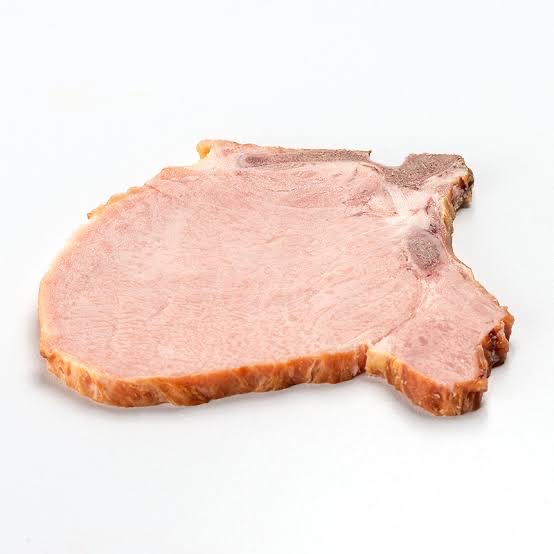 chuleta de cerdo al vapor con 2 huevos cocidos