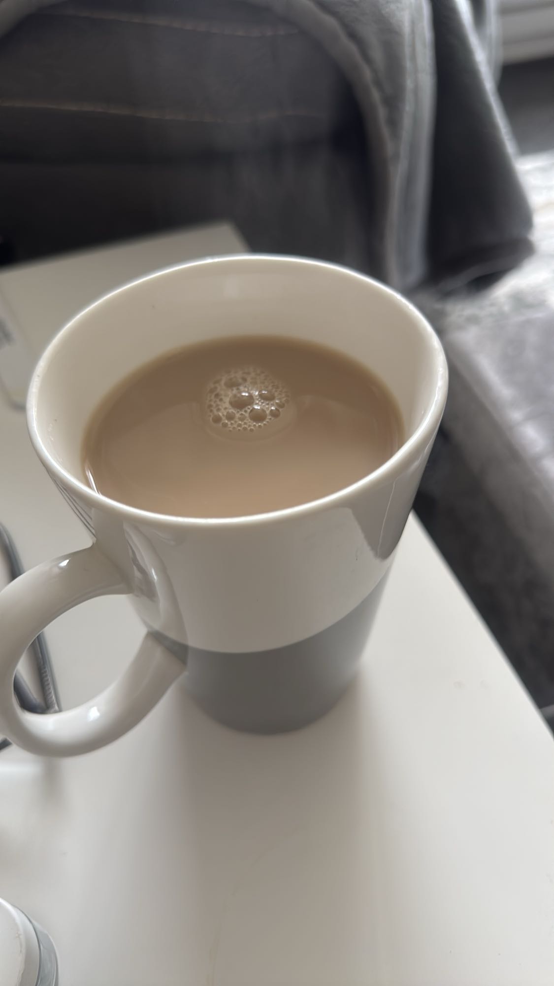 Cup of tea with 2 teaspoons of skimmed milk