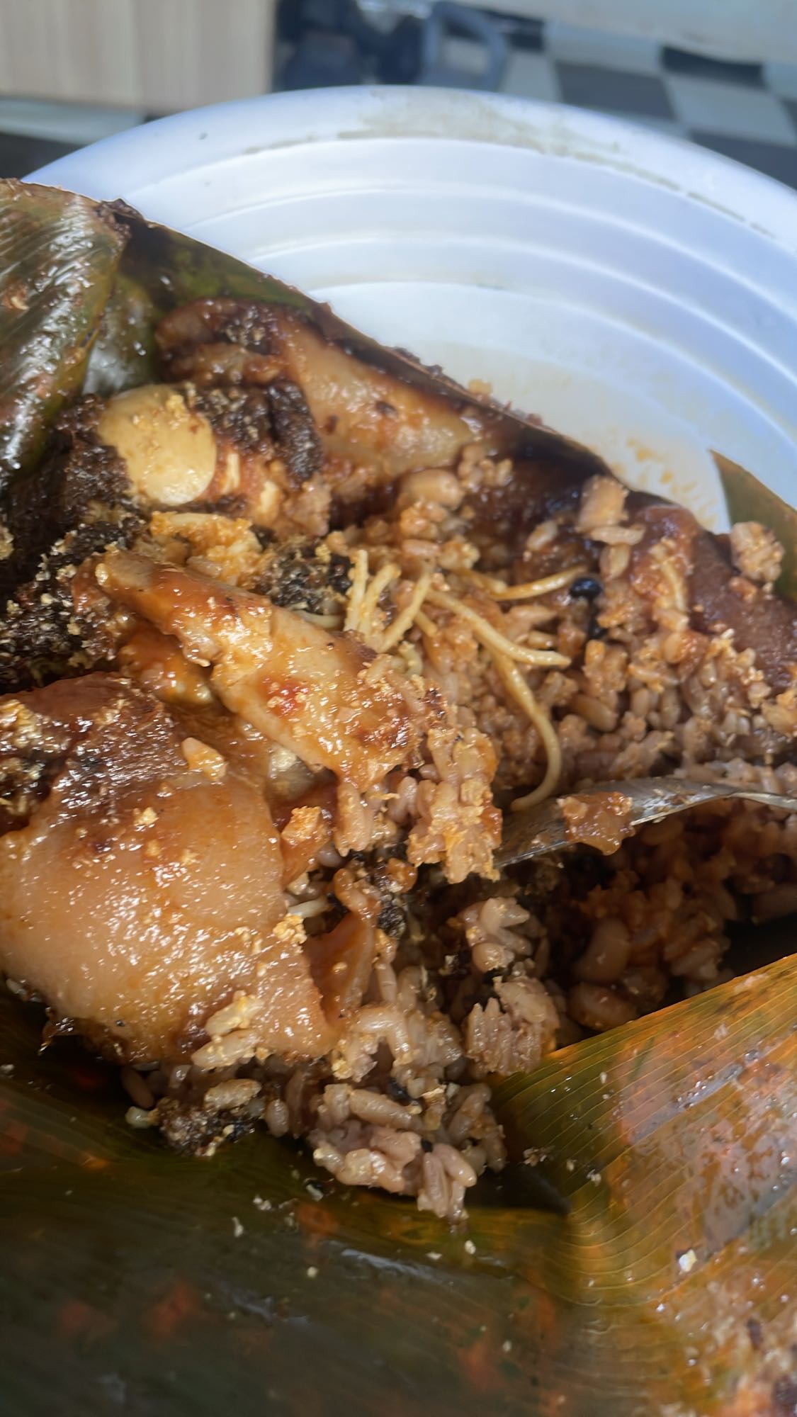 Waakye with Gari, Spaghetti, Boiled Egg, and Cow Skin
