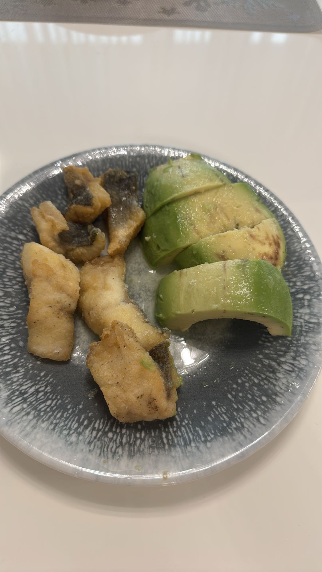 Fried fish and avocado