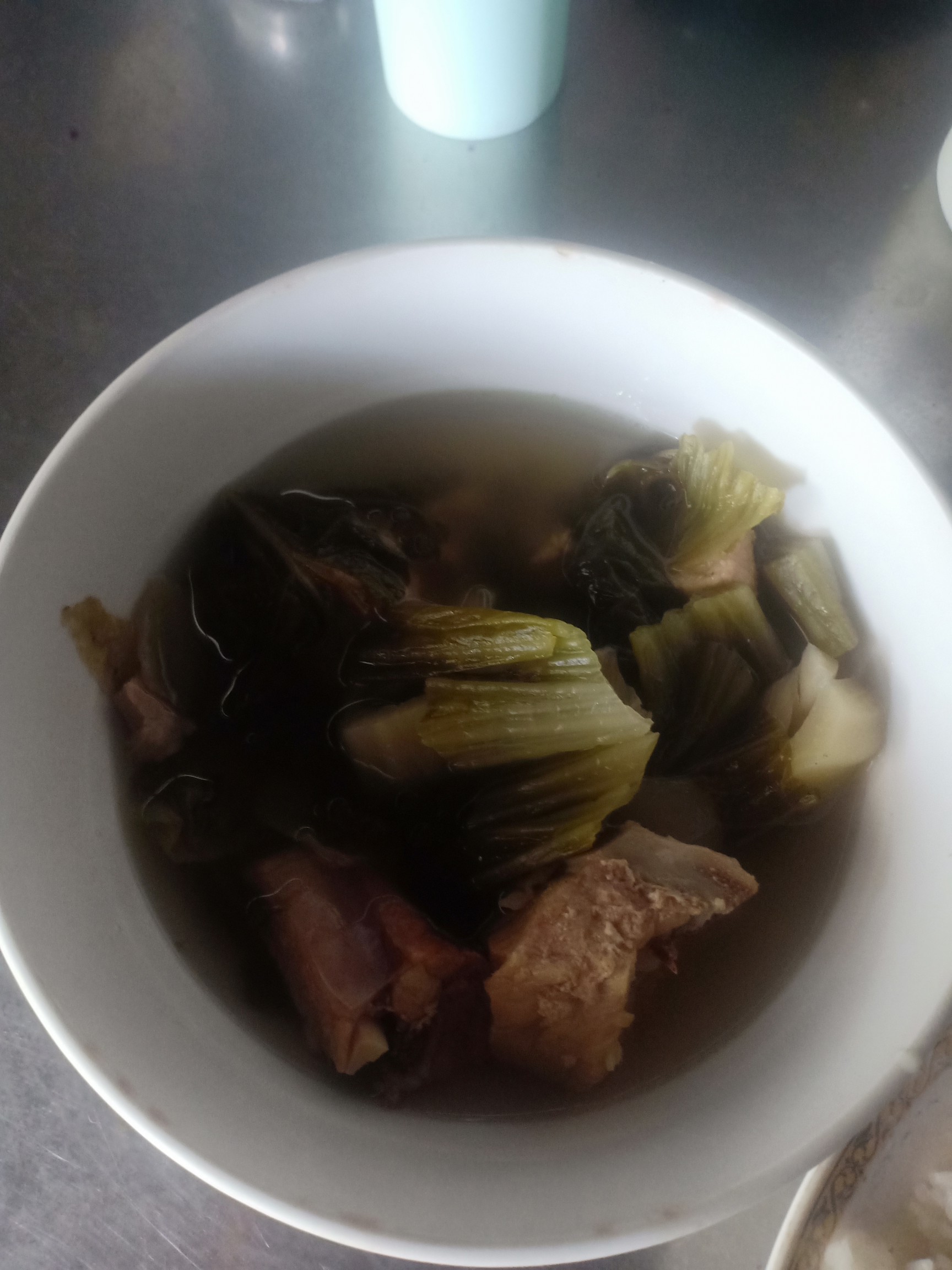 Pork rib and mustard green soup