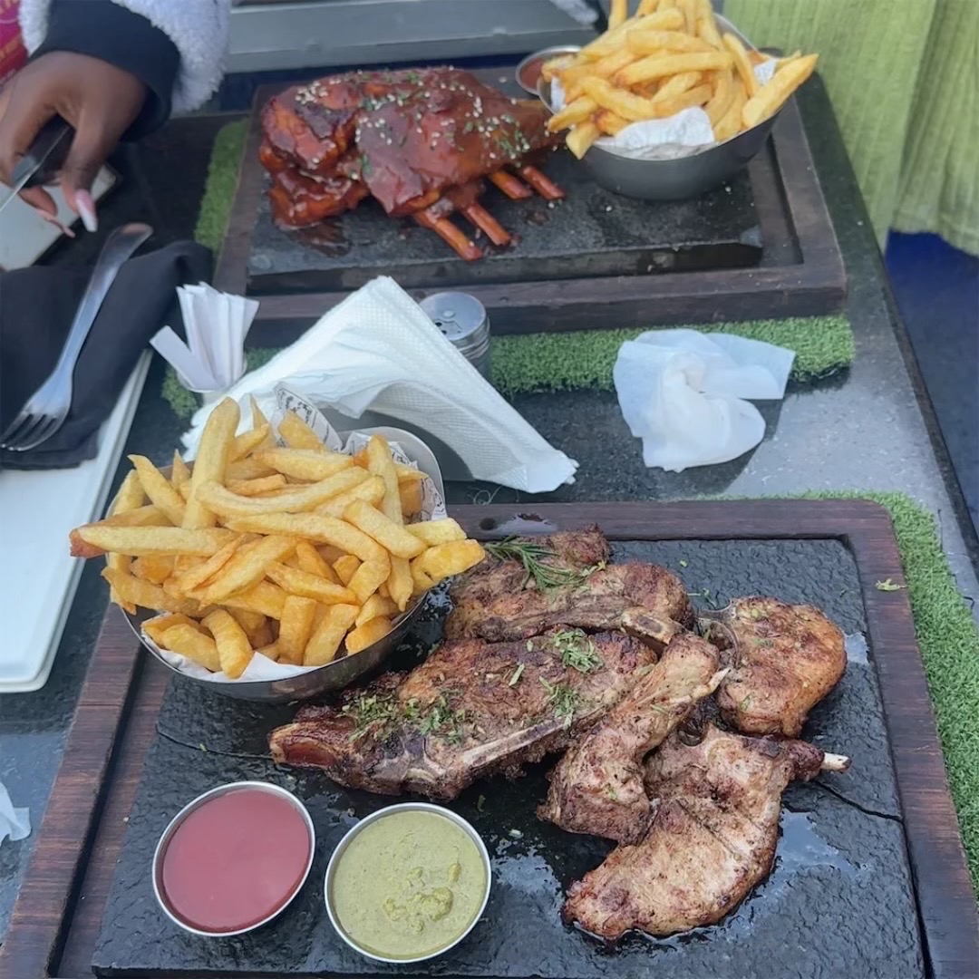 Grilled ribs, fries, sauces