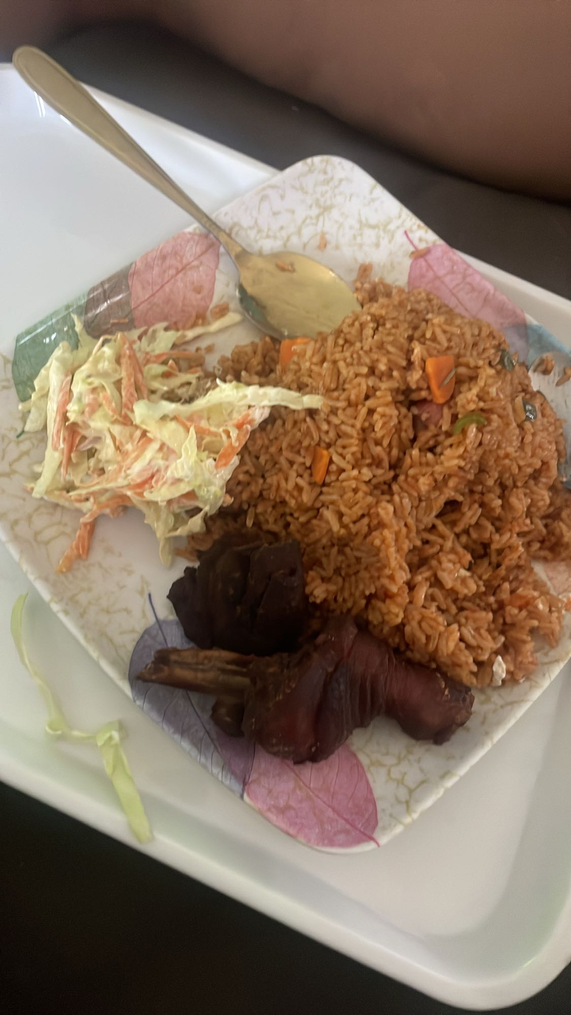 Jollof rice with salad and meat