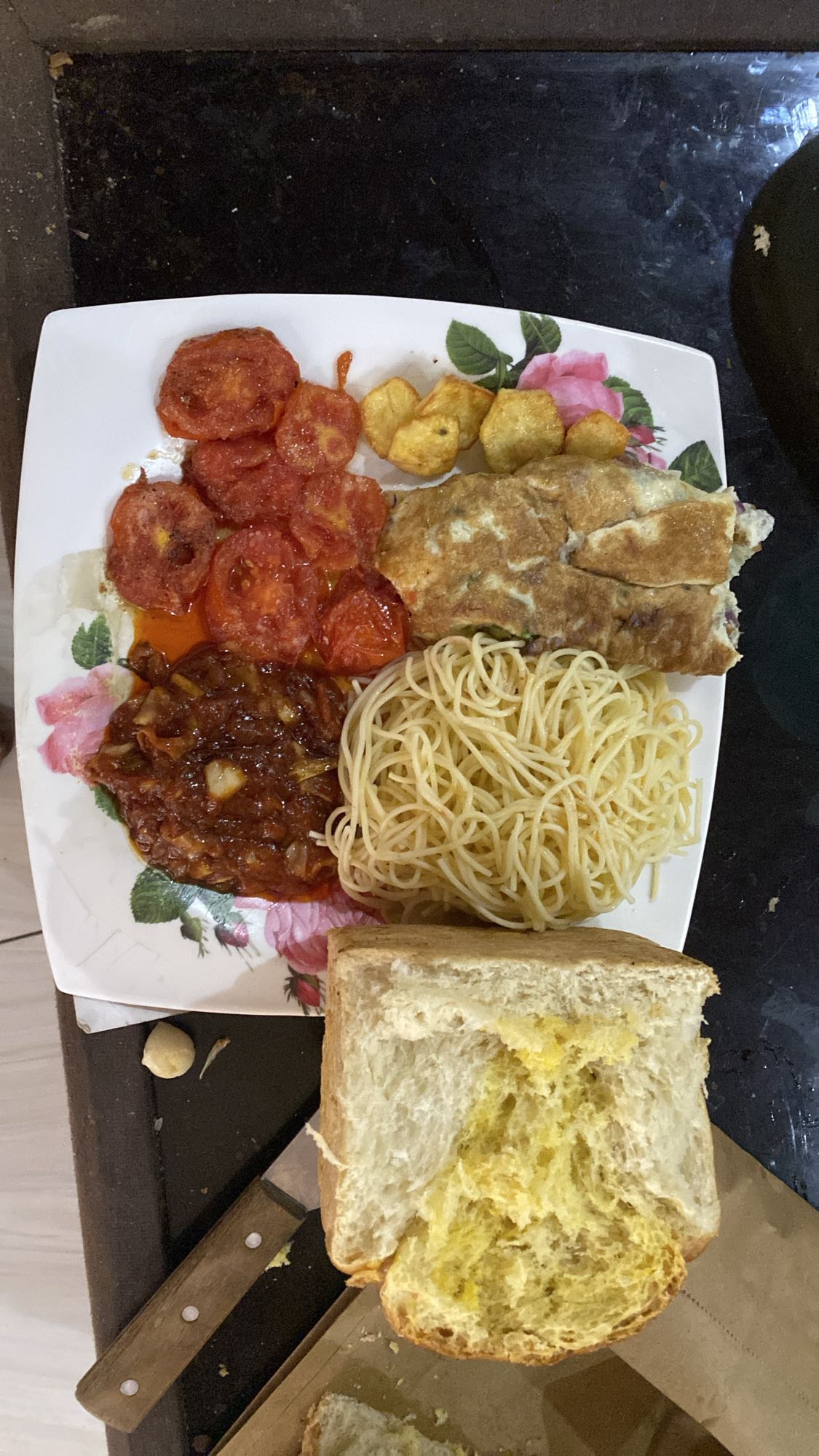 Egg, pasta, bread & tomato plate