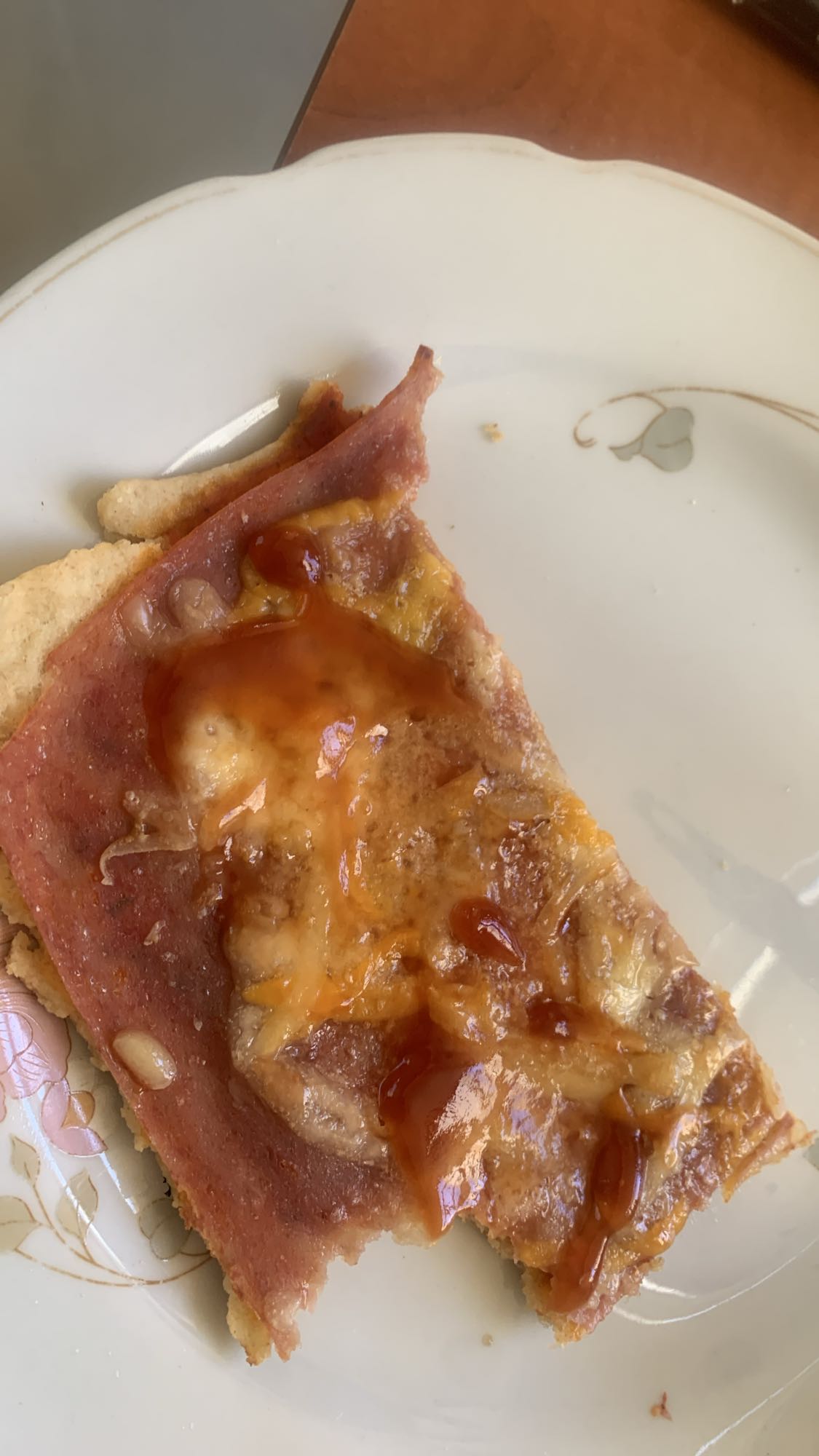 Ham and cheese pizza slice