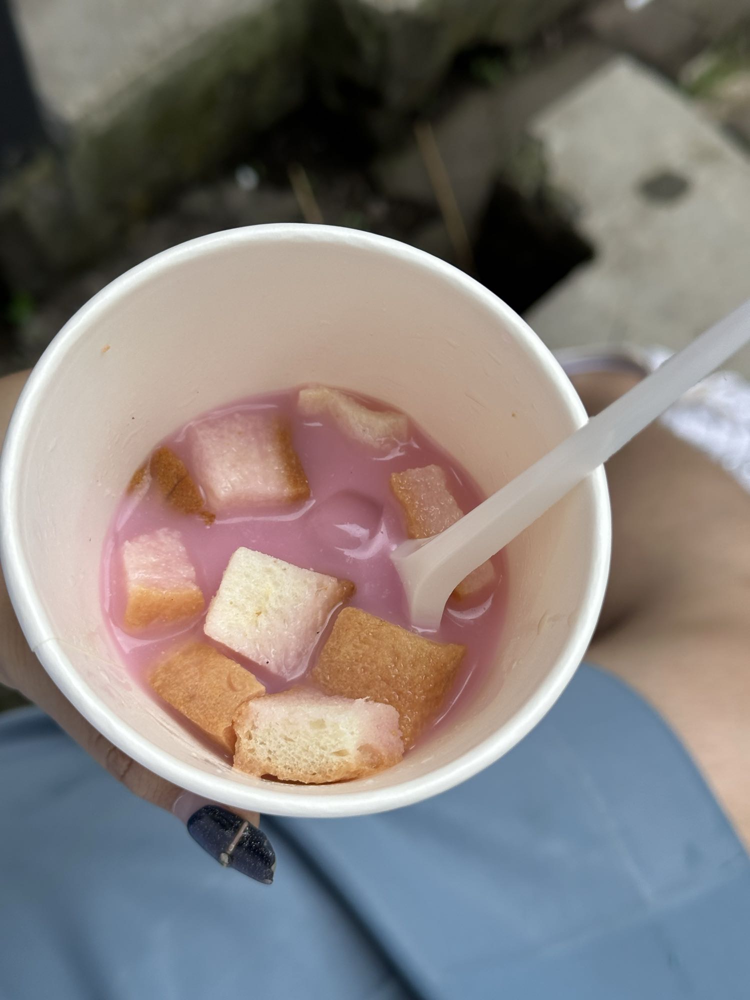 Pink milk with bread cubes