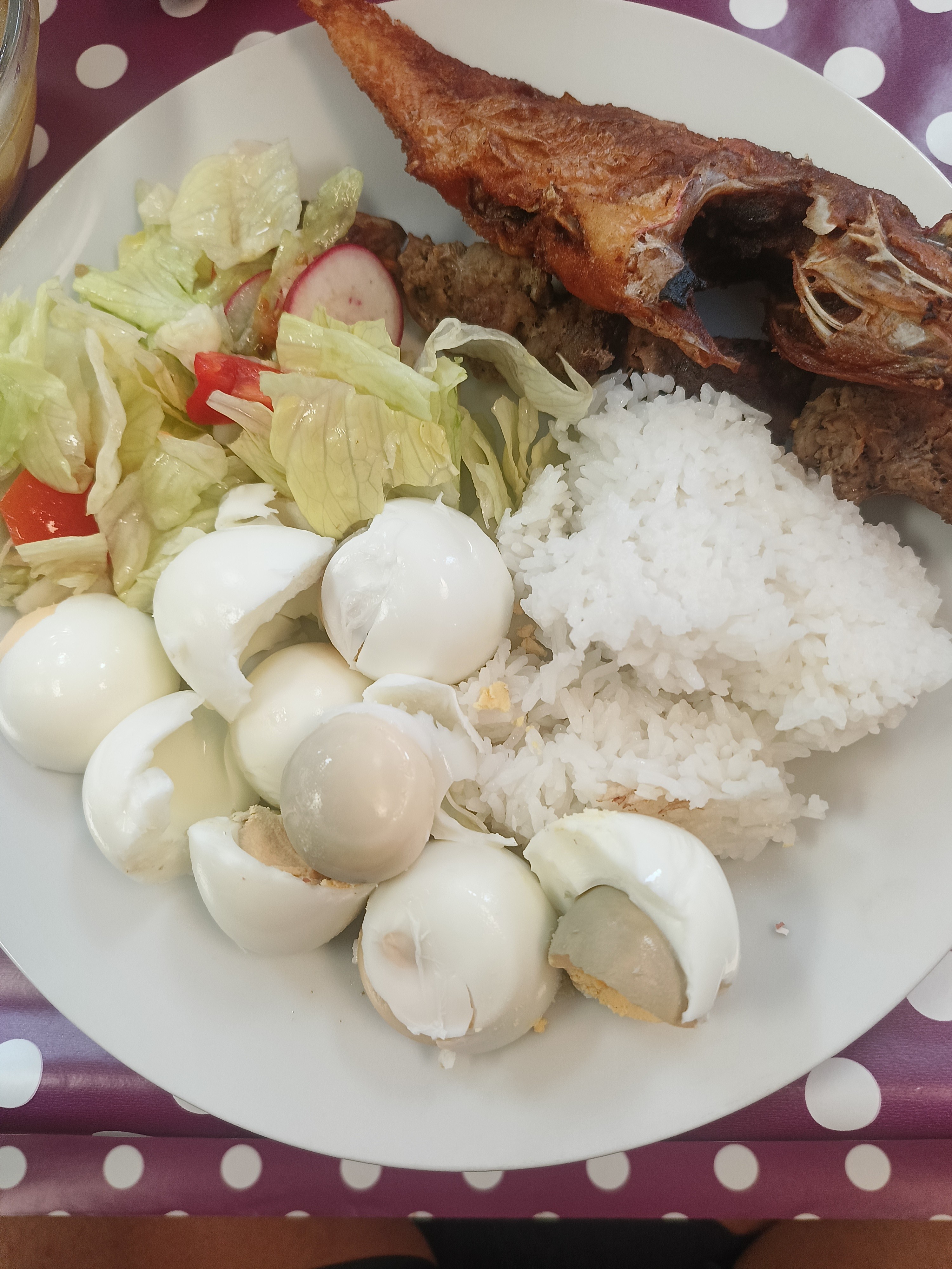 Fish, eggs, rice, salad plate