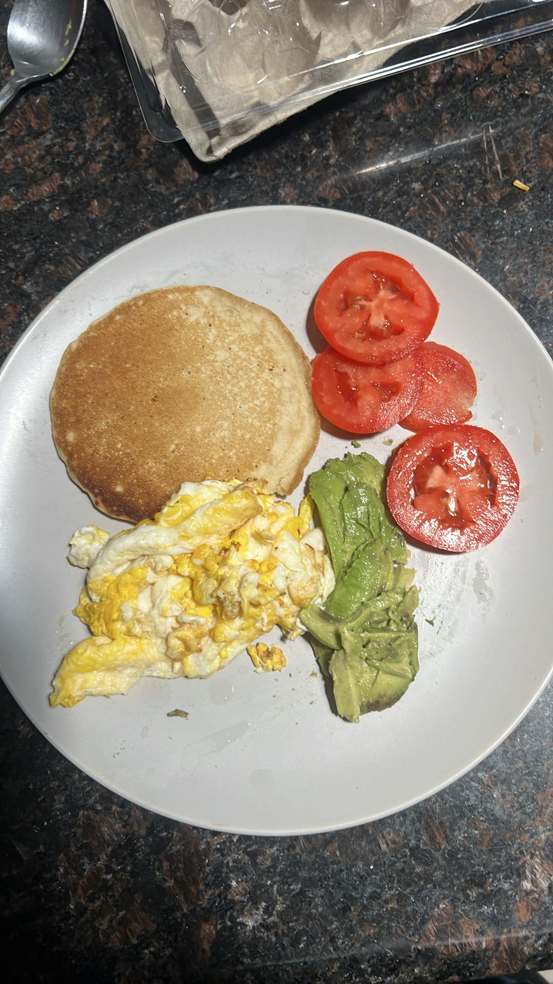 Eggs, pancake, avocado, tomato