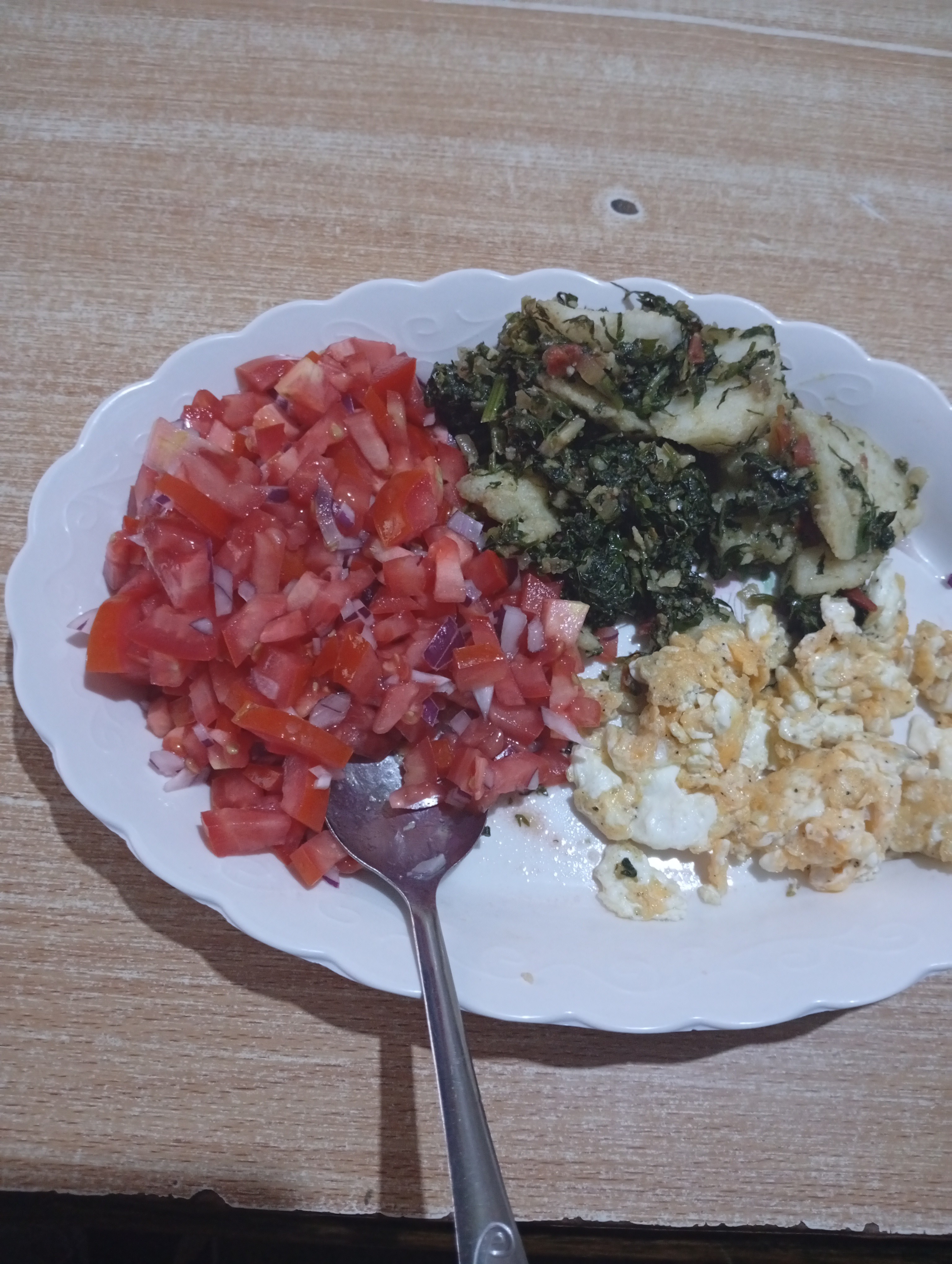 Eggs, greens, tomato salad