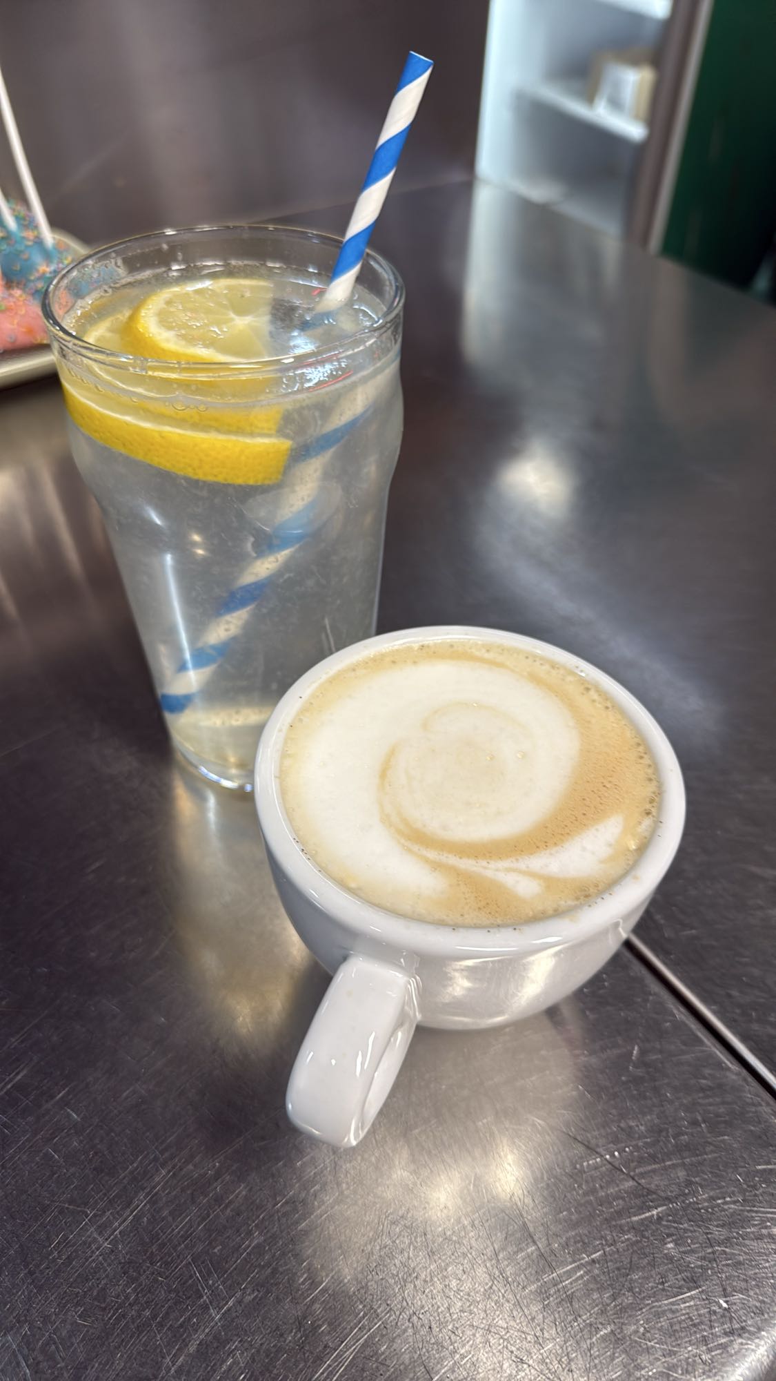 Lemon water and cappuccino