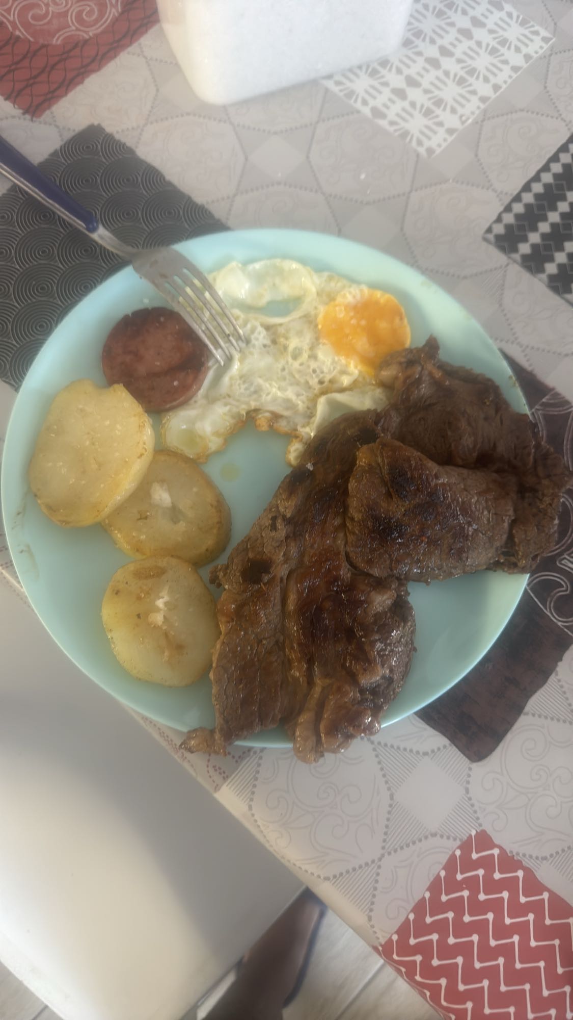 Steak, egg, potato breakfast