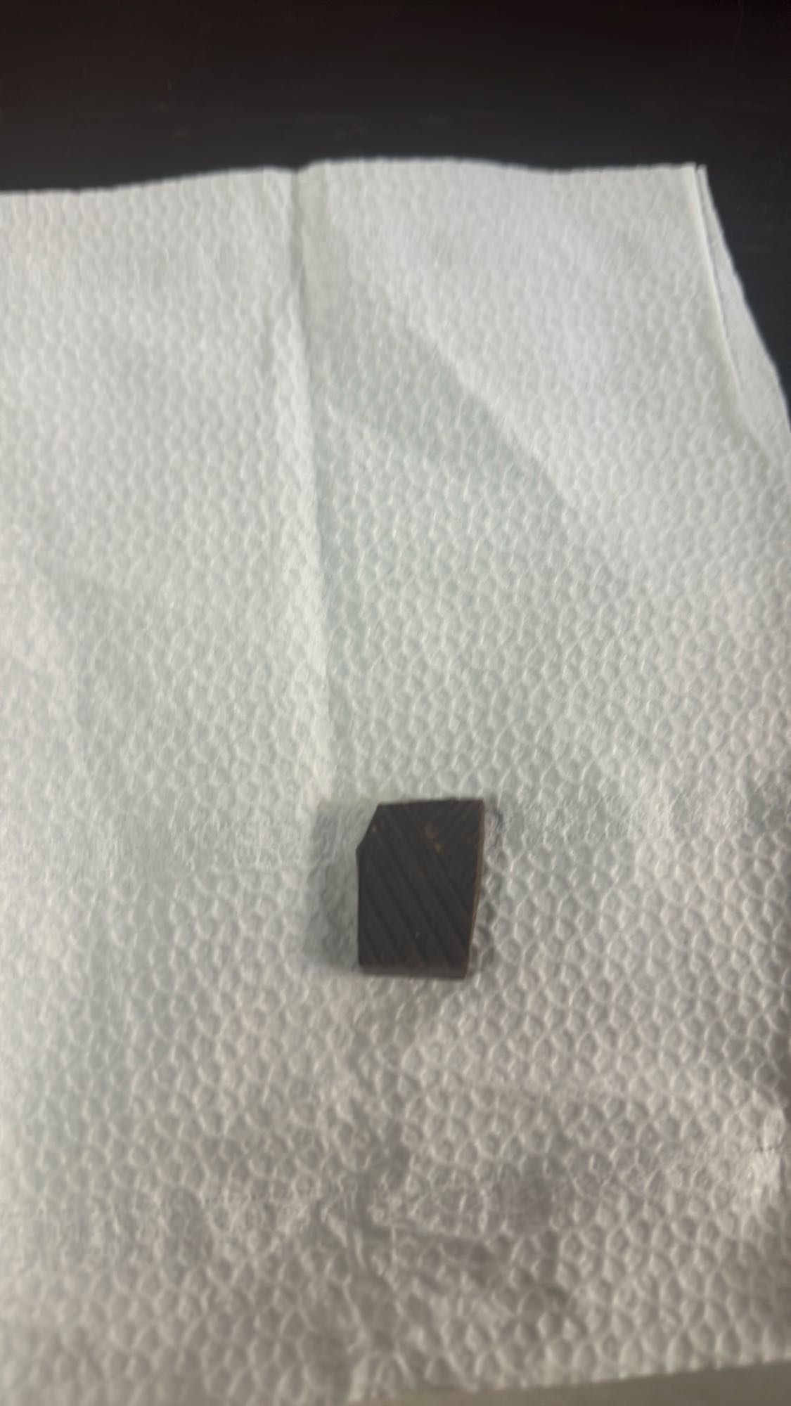 Small dark chocolate piece