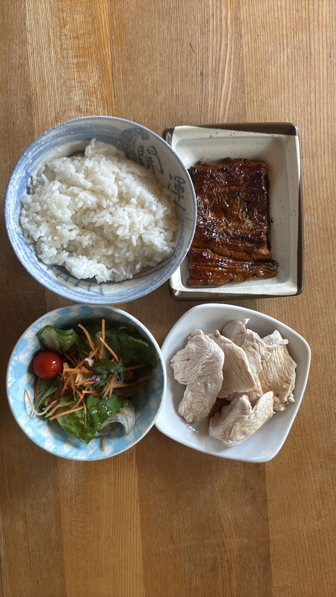 Rice, eel, chicken, salad