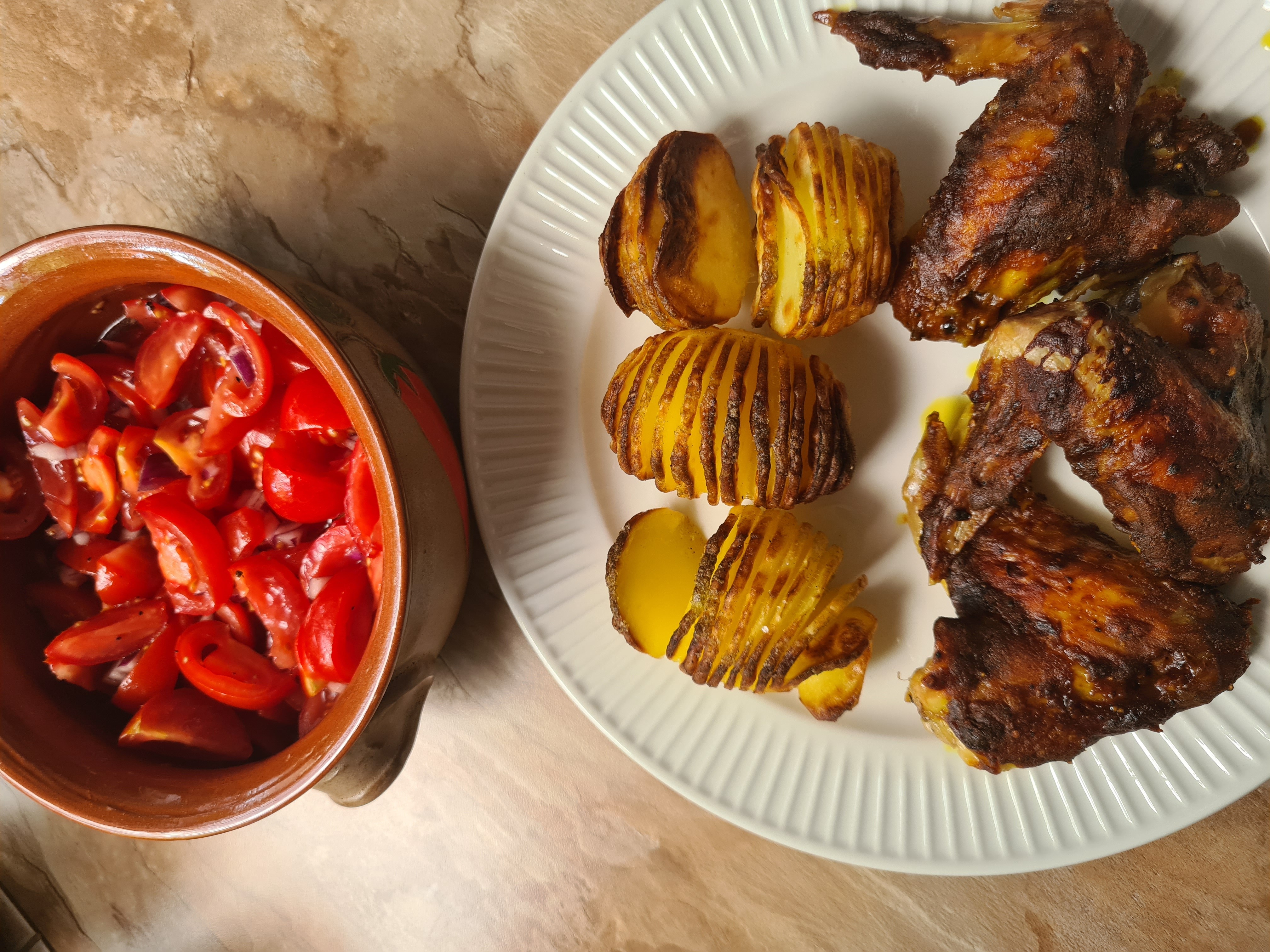 Chicken wings, potatoes, salad