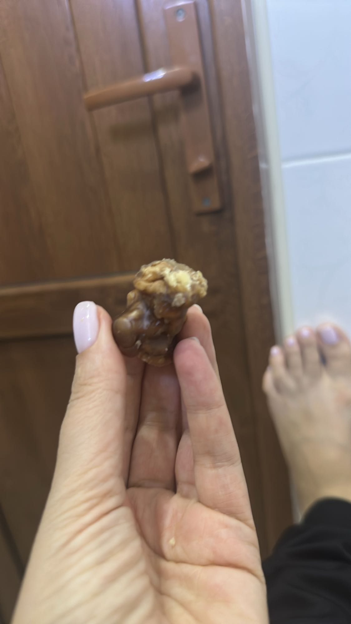 Single walnut piece with grape juice