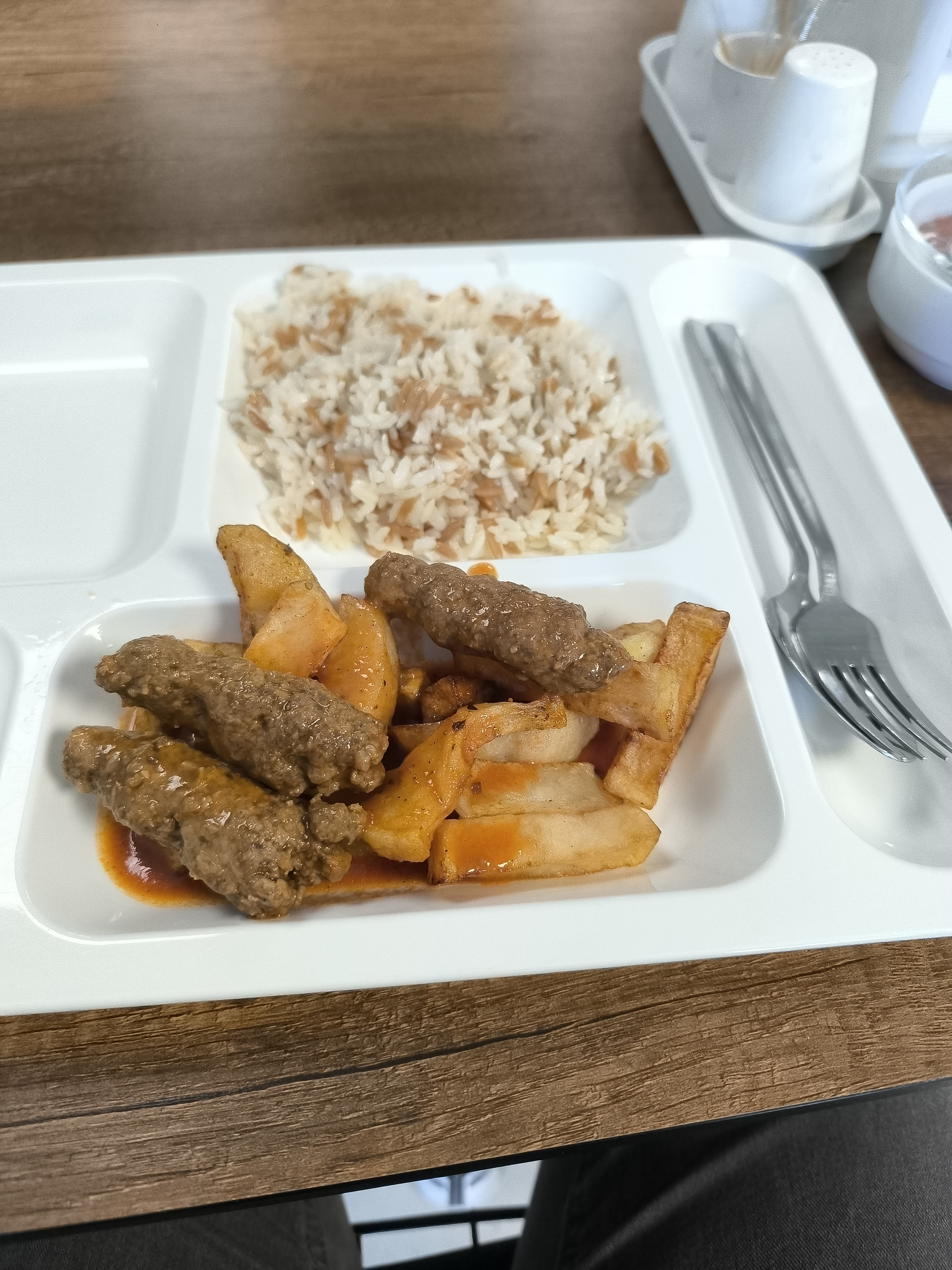 Rice, fries, and kebab plate