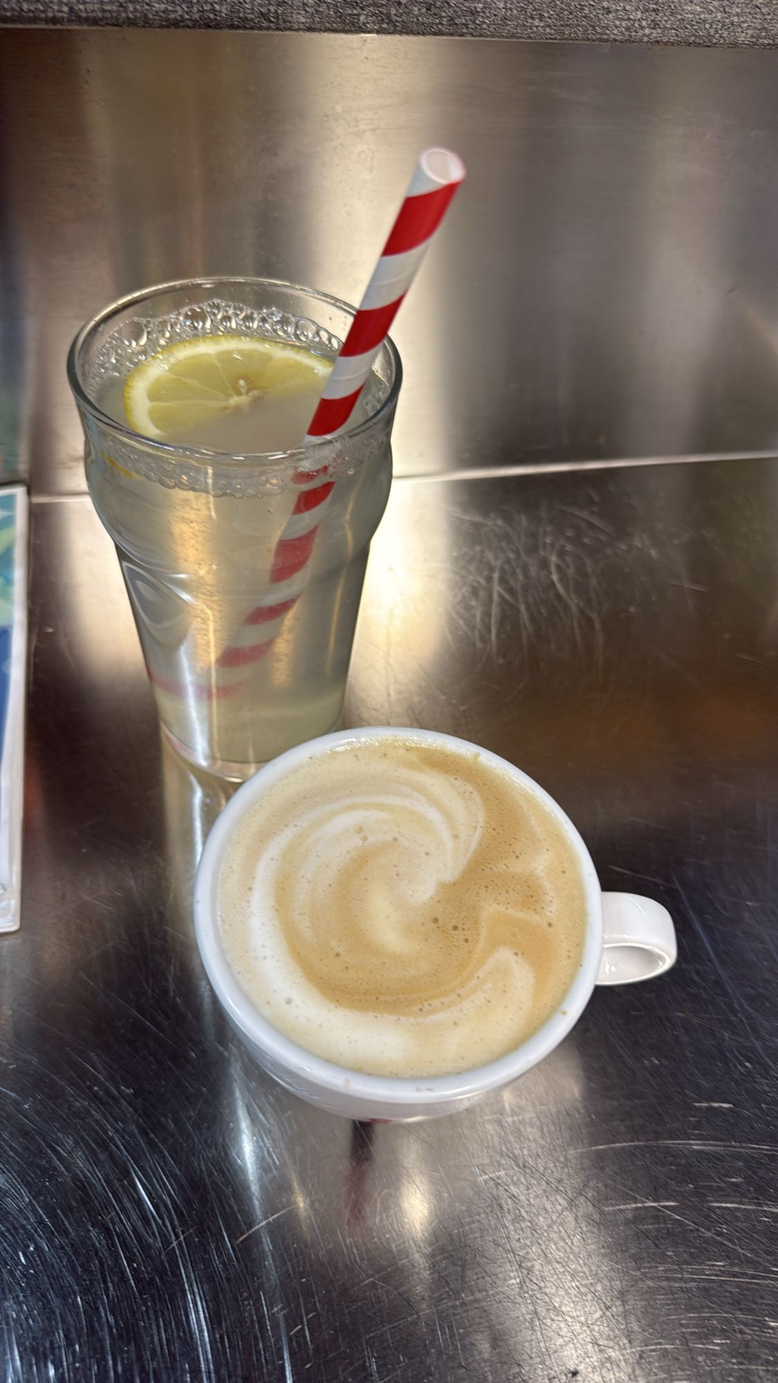 Lemon water and cappuccino
