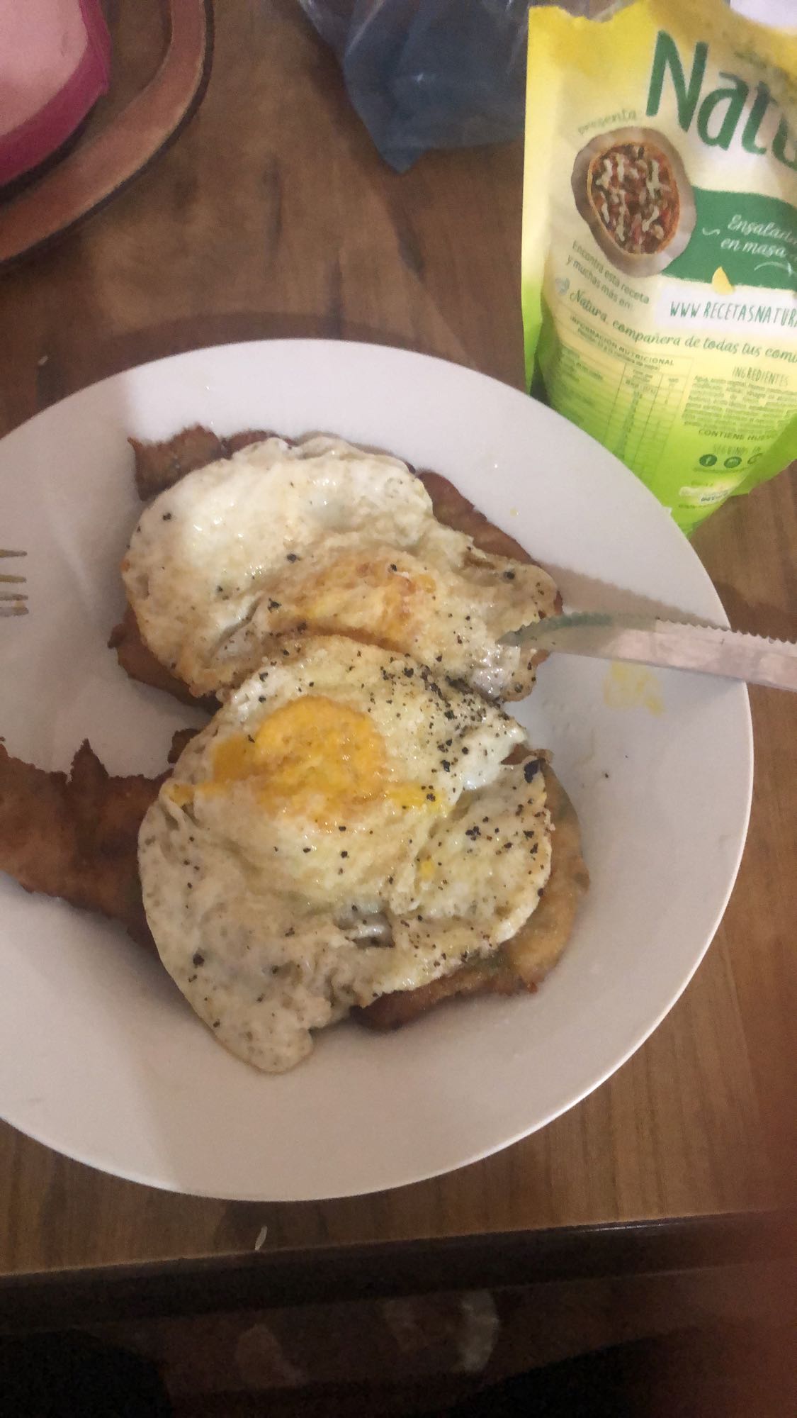 Milanesa con huevos fritos