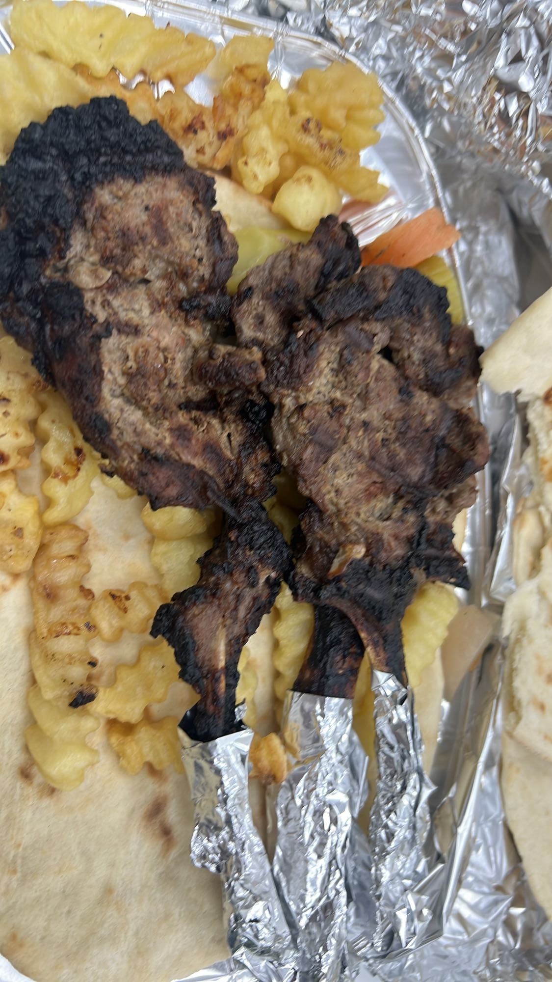 Lamb chops with fries and pita
