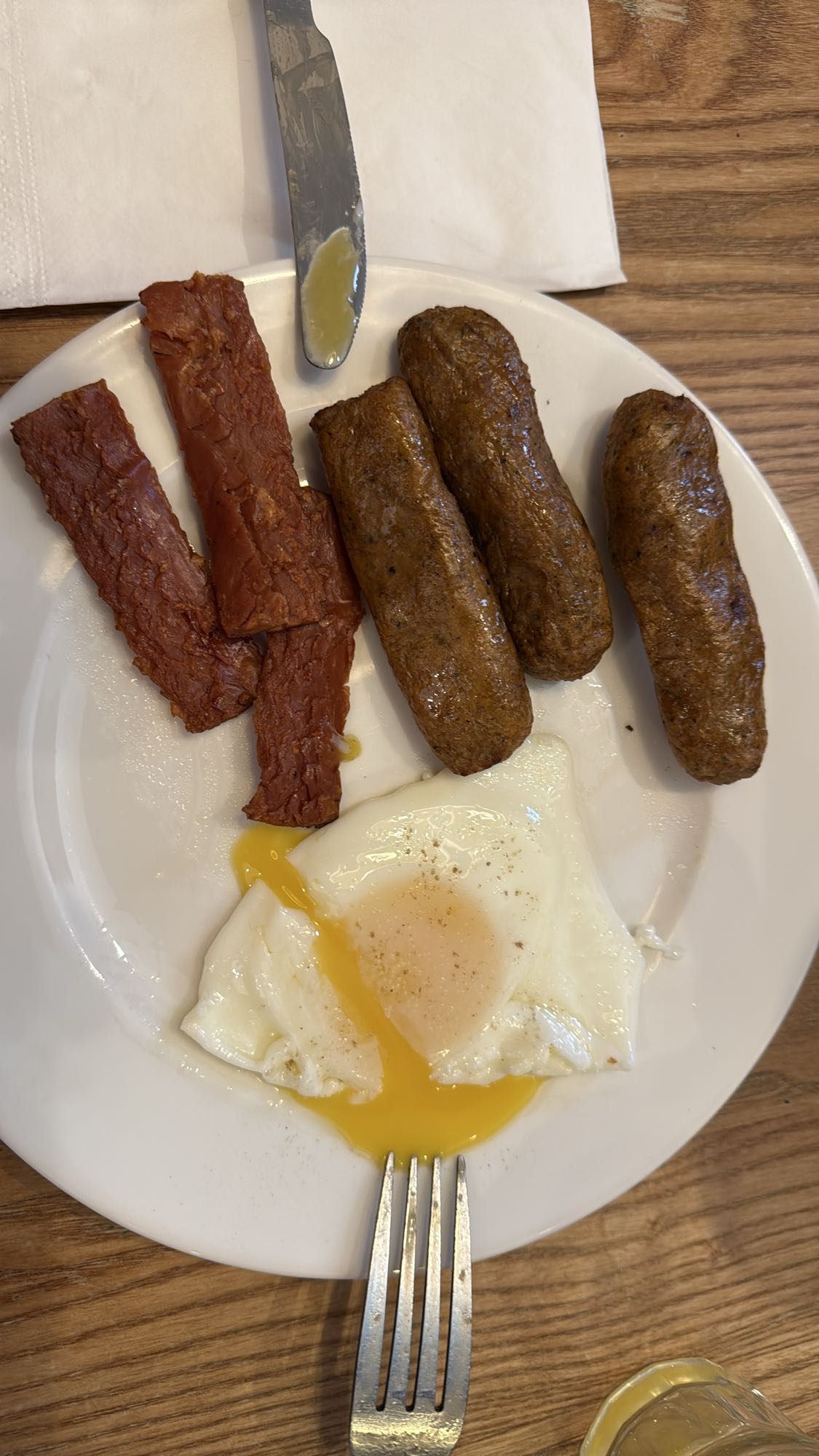Egg, vegetarian sausage, and vegetarian bacon plate