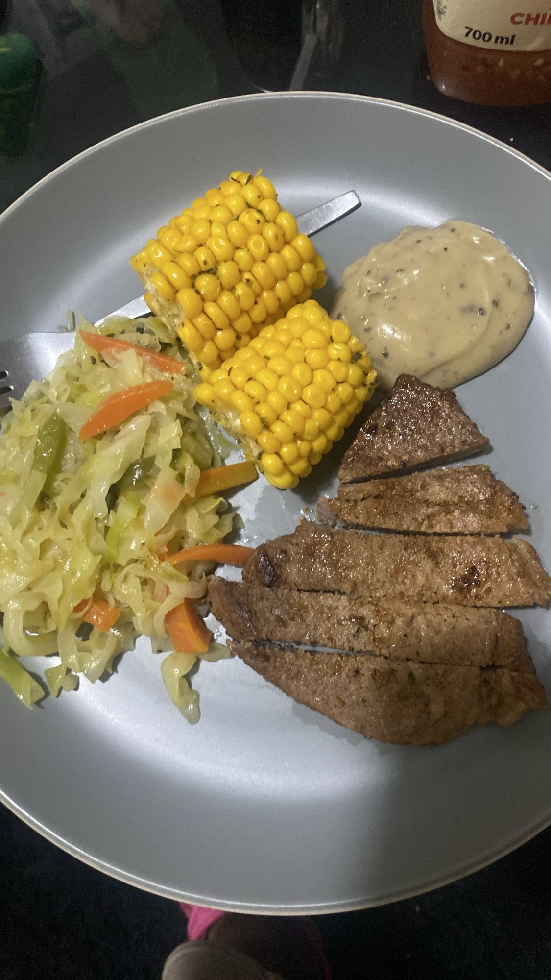 Steak, corn, veggies, sauce