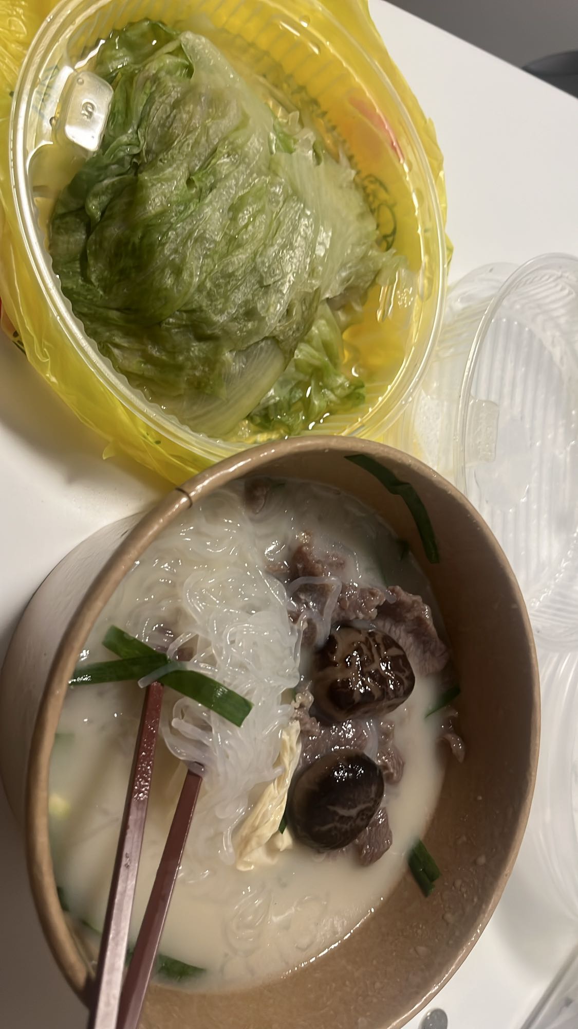 Beef noodle soup with lettuce