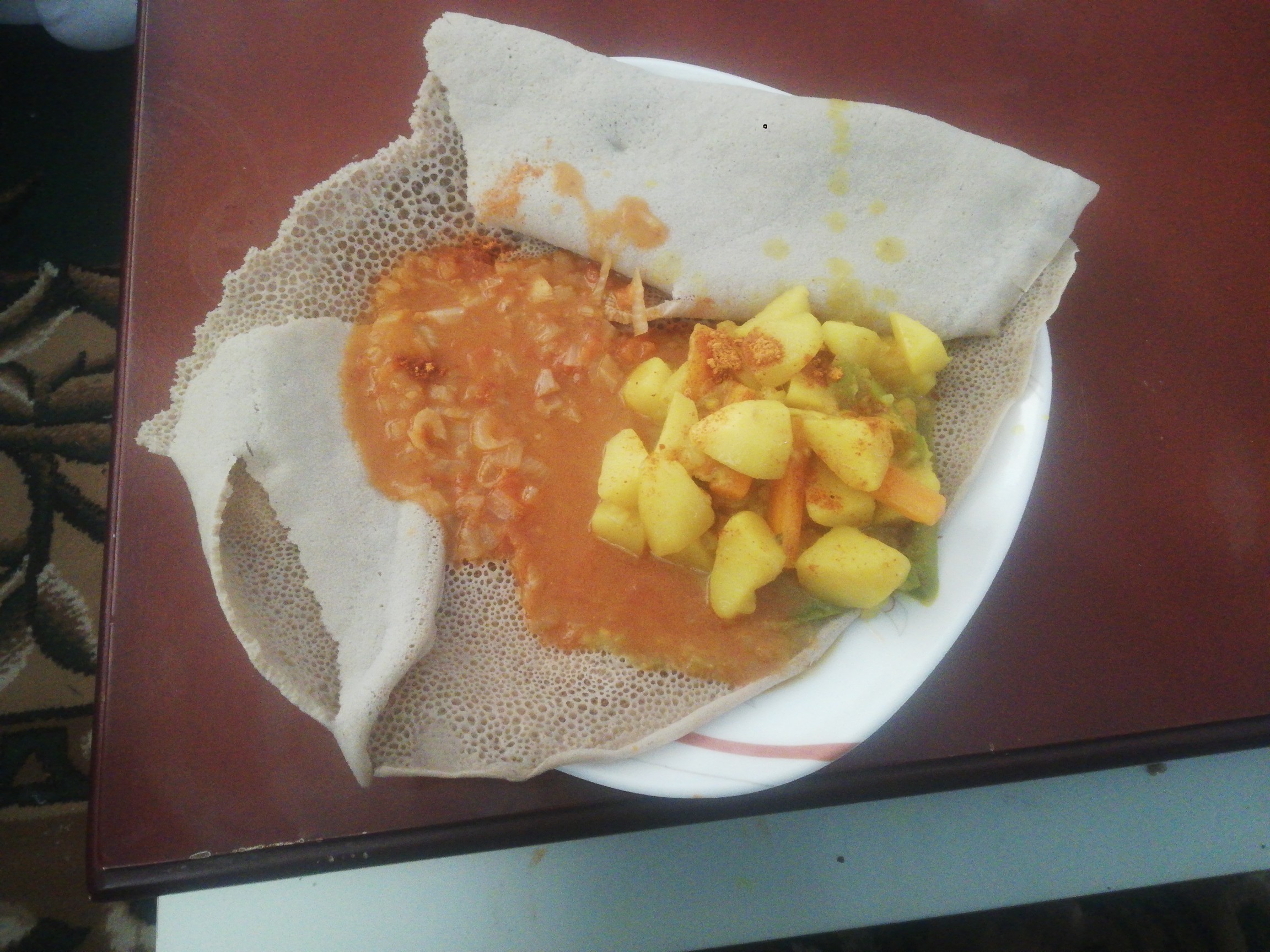 Injera with stew & veggies