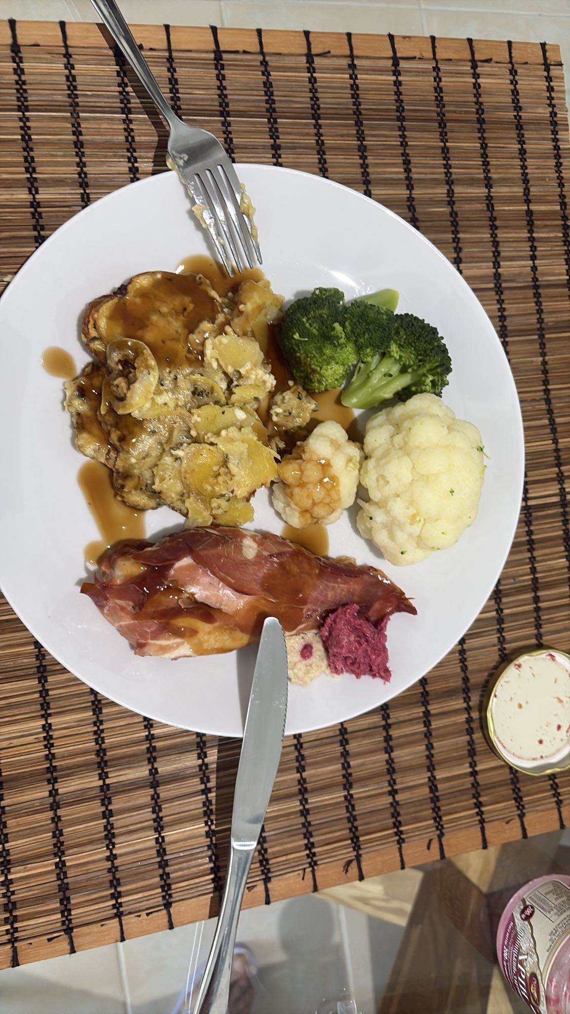 Chicken breast wrapped in Serrano with potato bake and vegetables