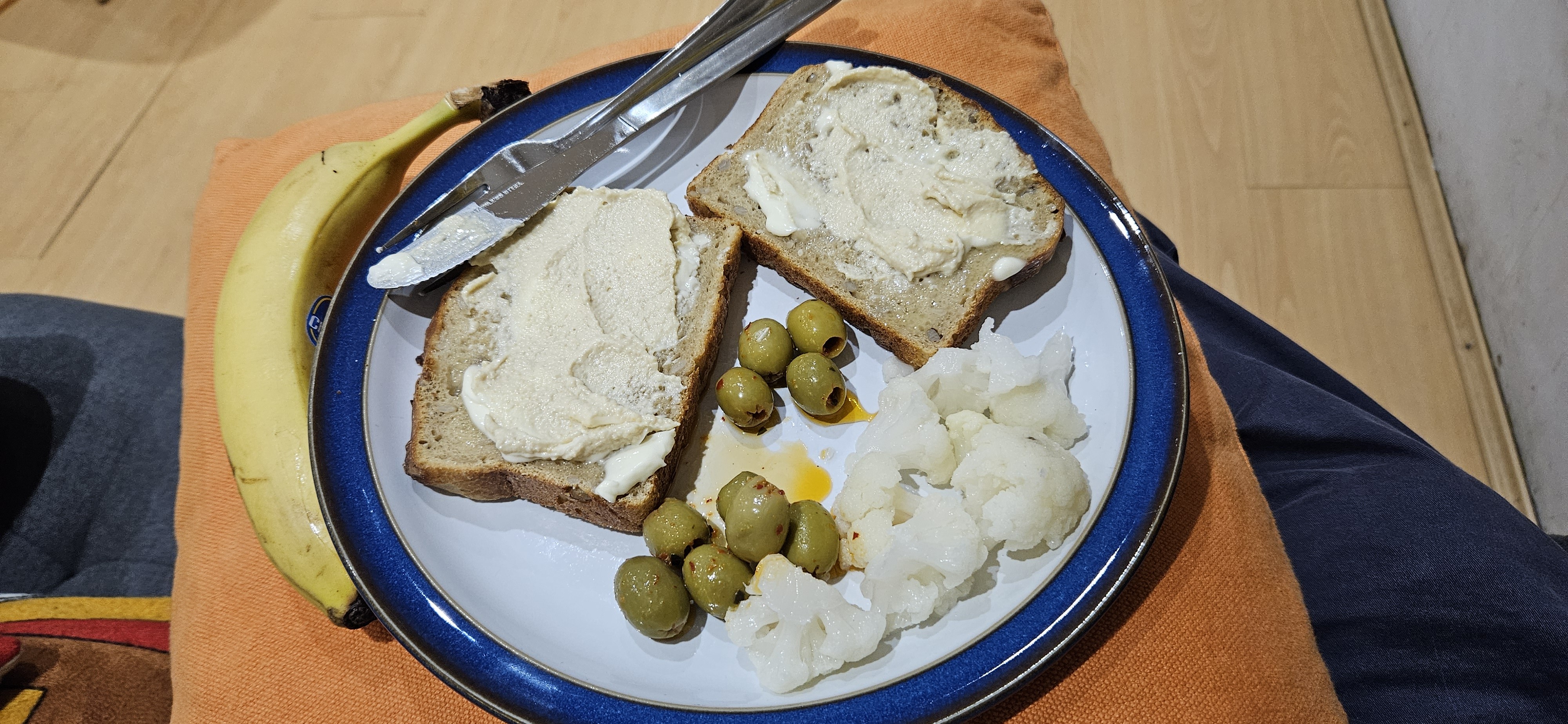 Bread, hummus, olives, banana