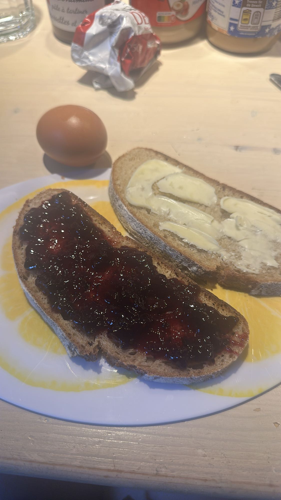 Bread with butter, jam, egg