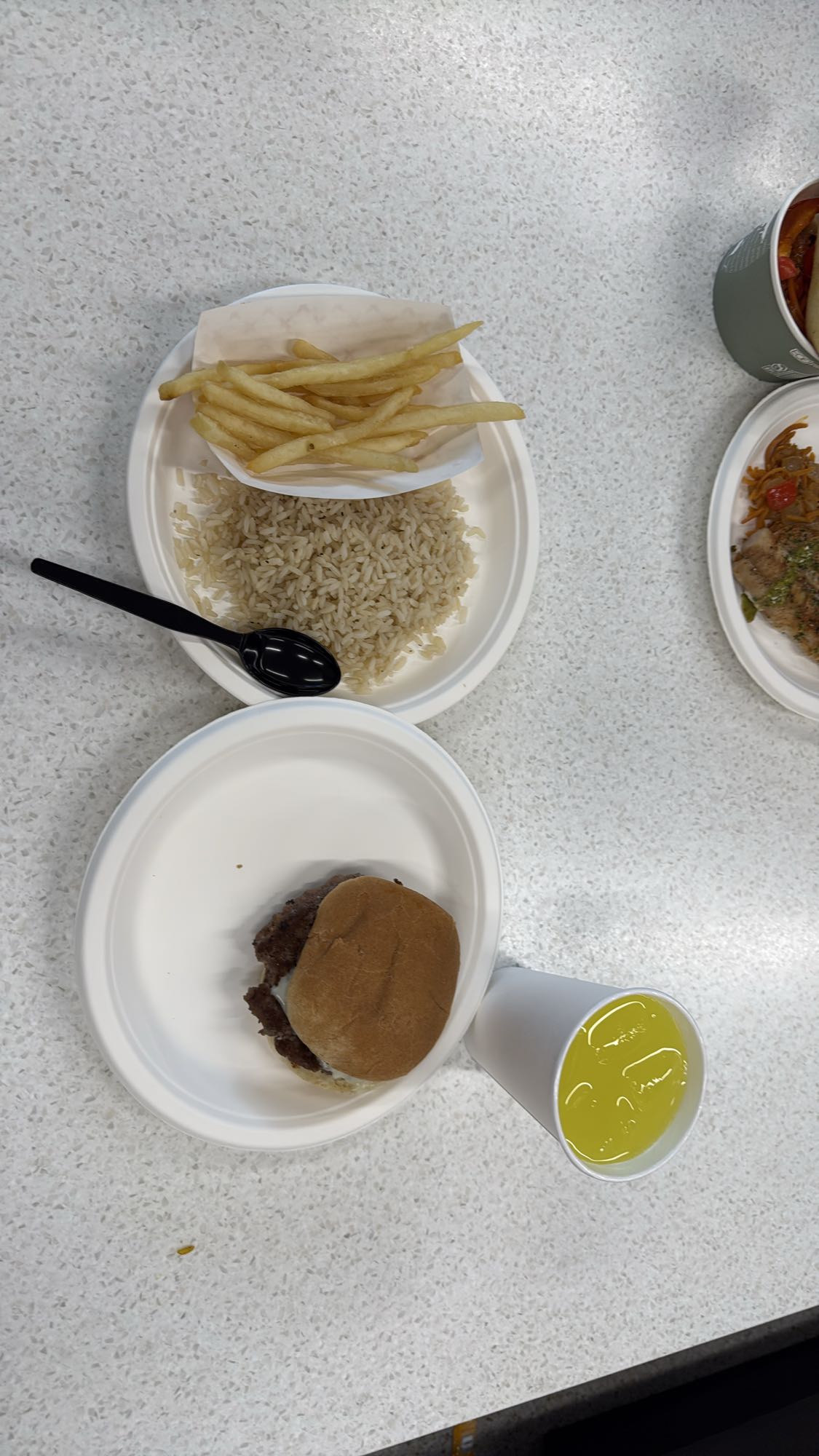 Burger with rice and fries