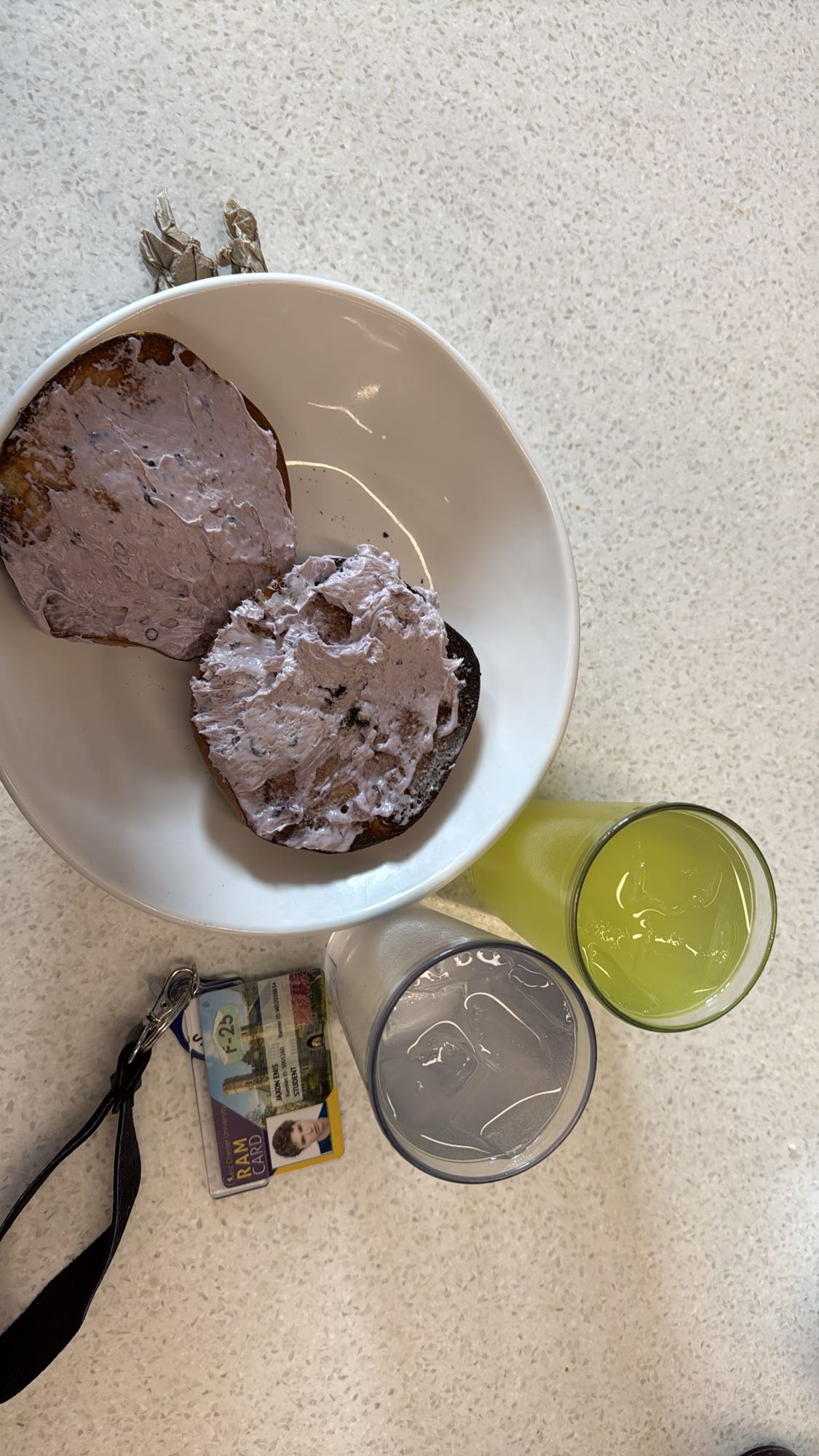 Bagel with berry cream cheese and drinks