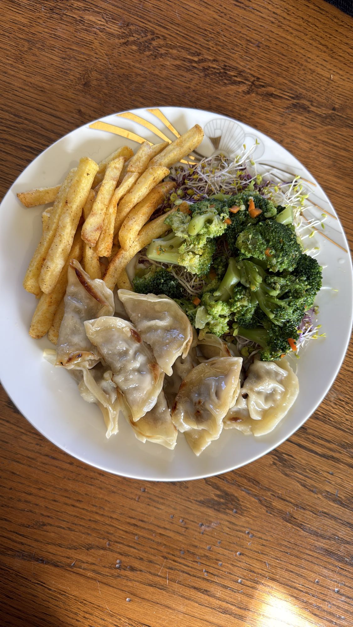 Dumplings, fries, broccoli