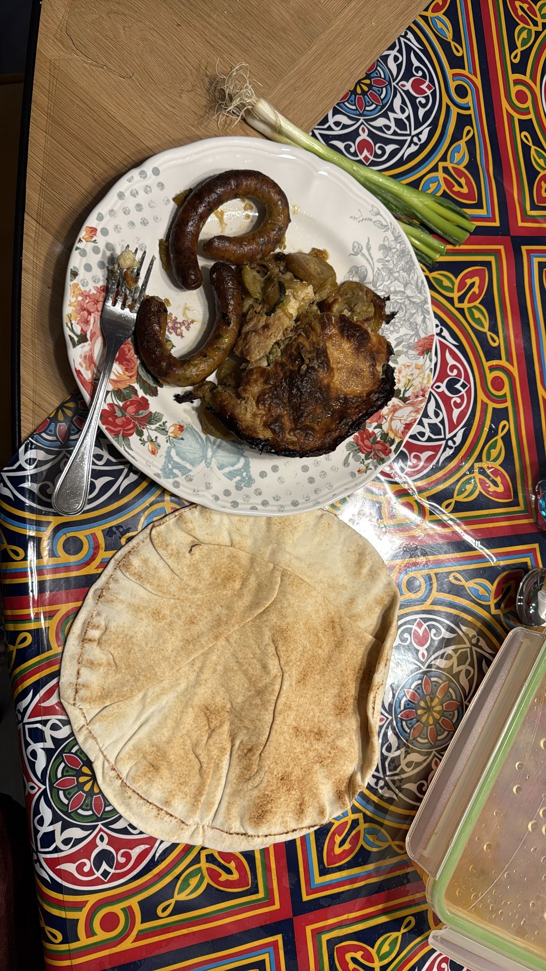 Chicken sausage, koussa with bashamel, pita, onion