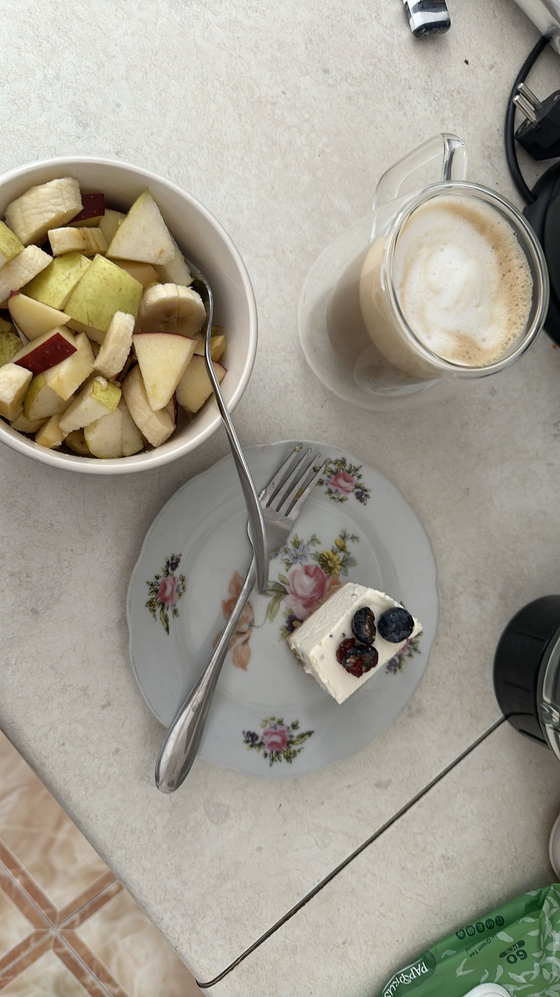 Fruit bowl, cheesecake, latte