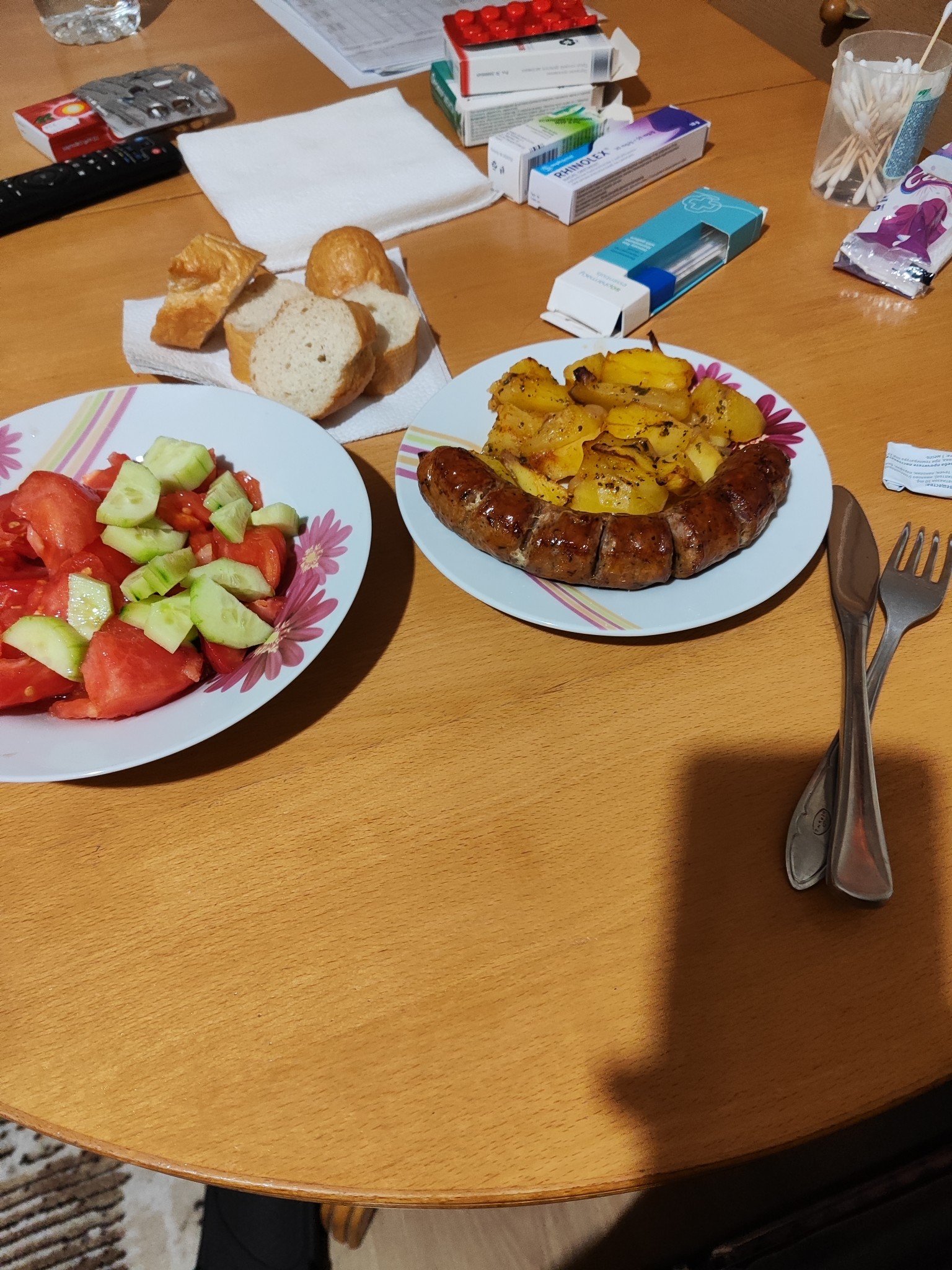 Sausage, potatoes, salad, bread