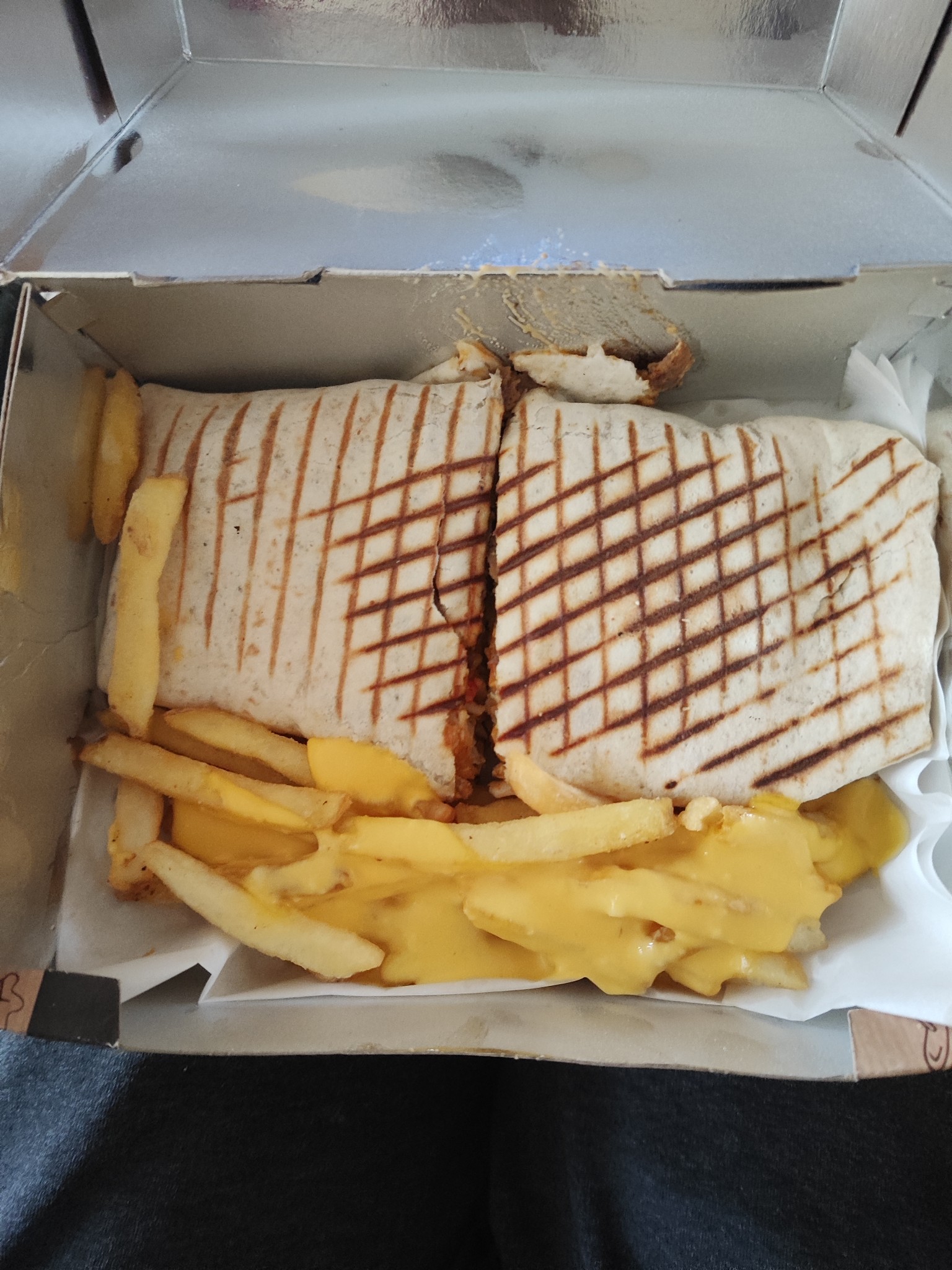 Grilled wrap with cheesy fries