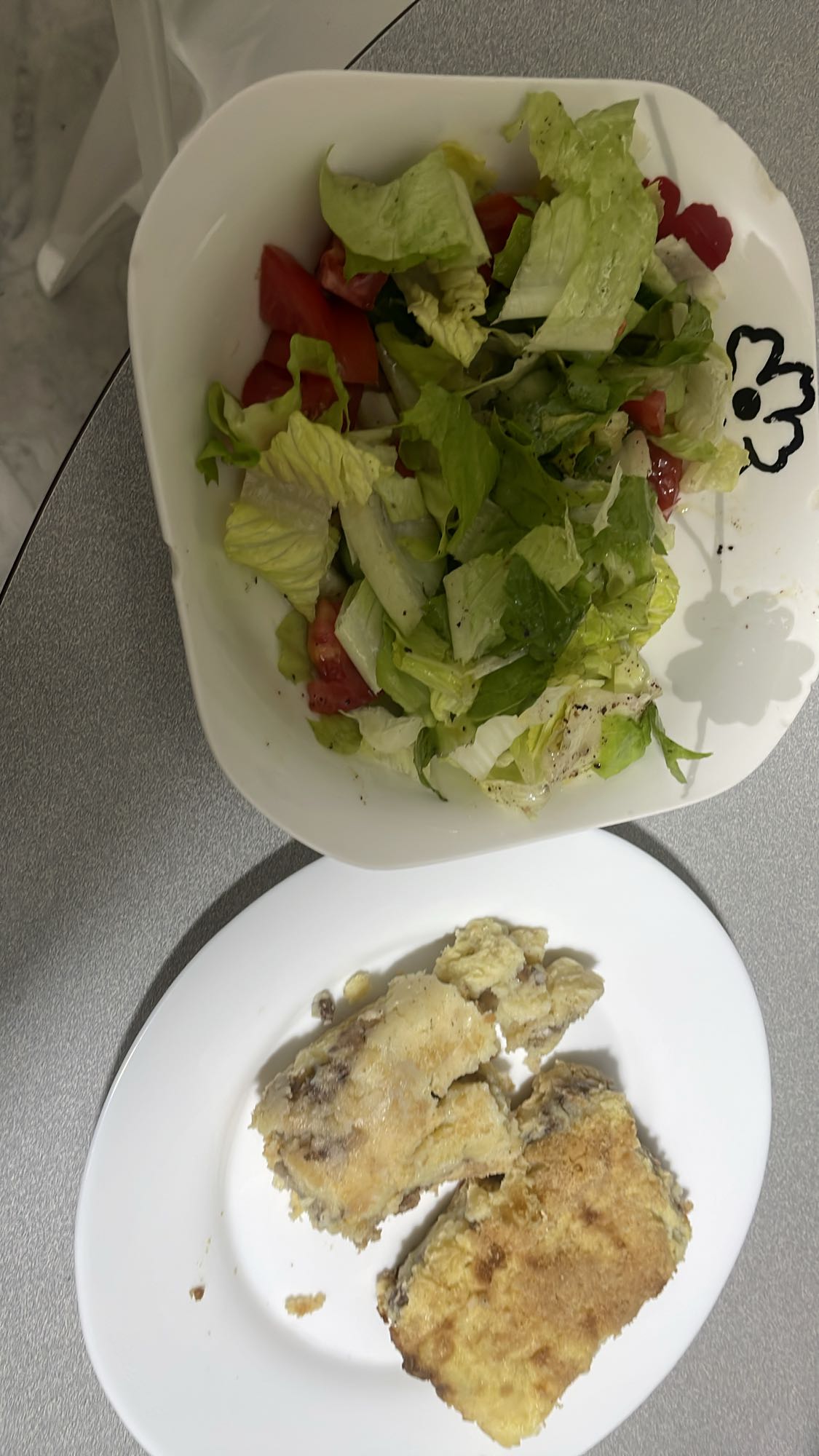 Salad and breaded meat