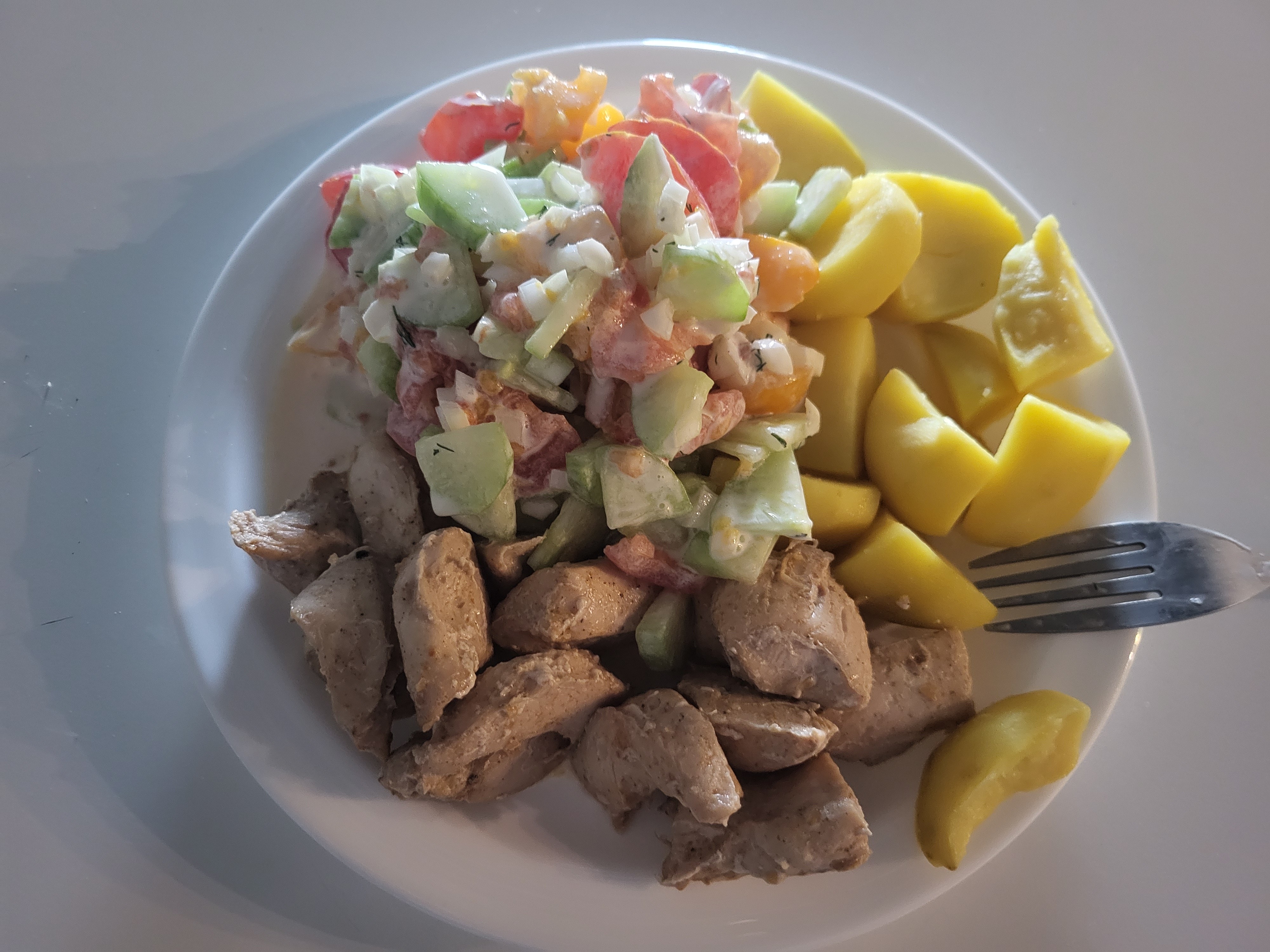 Chicken, salad, and potatoes