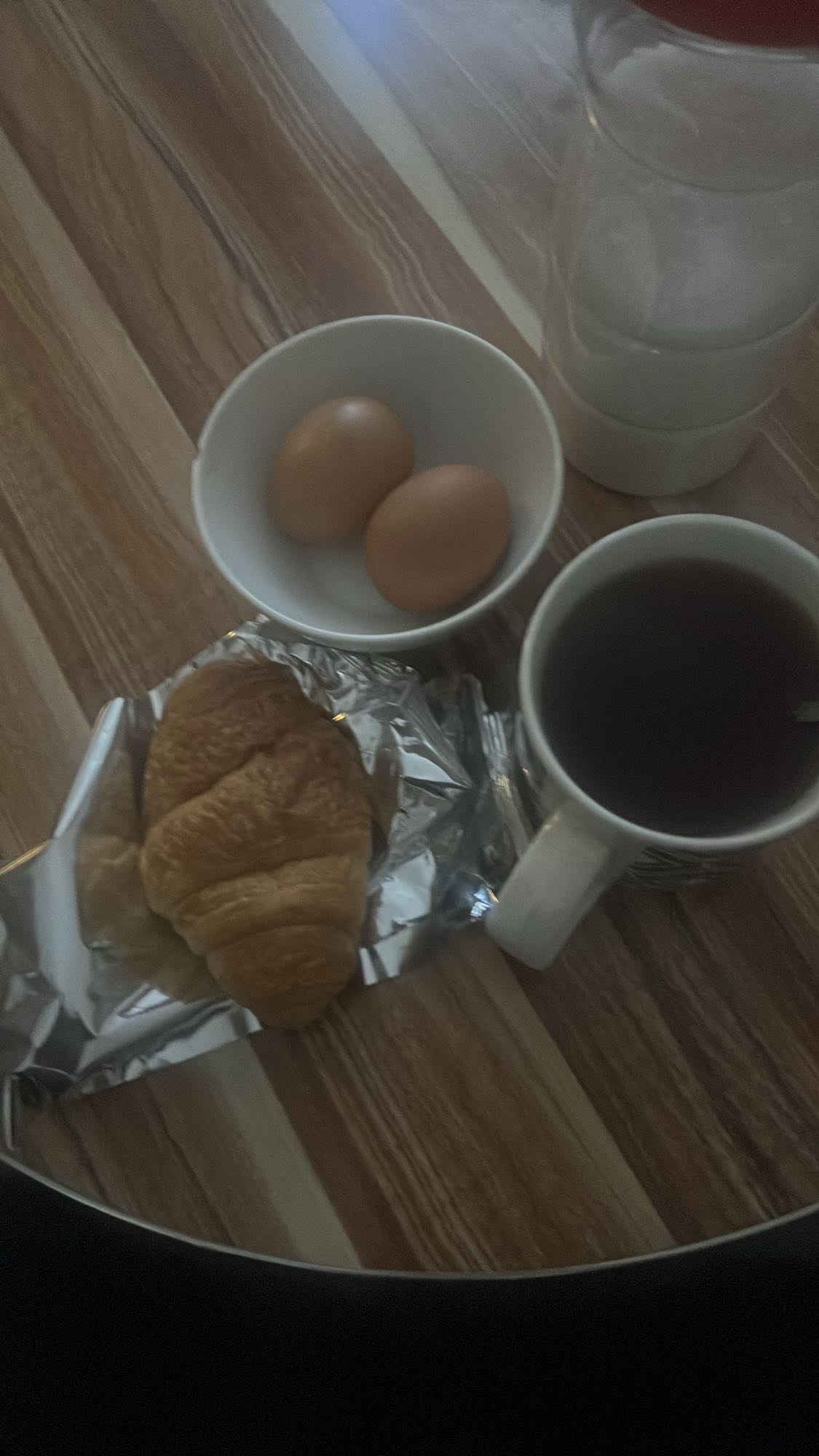 Eggs, croissant, tea, milk