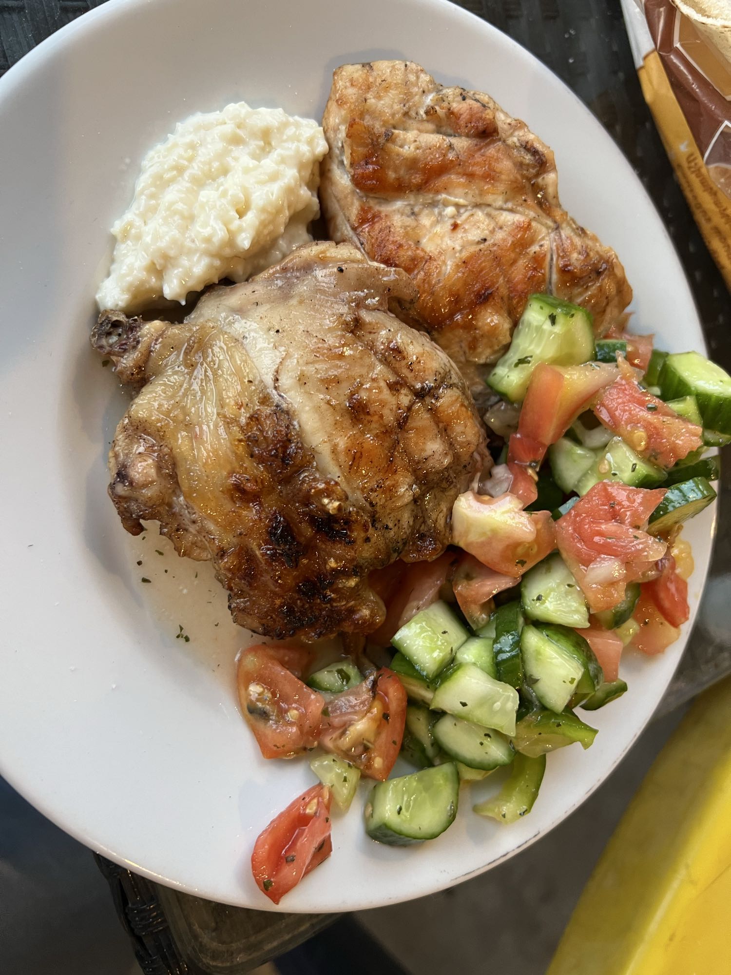Grilled chicken breast with salad and garlic paste