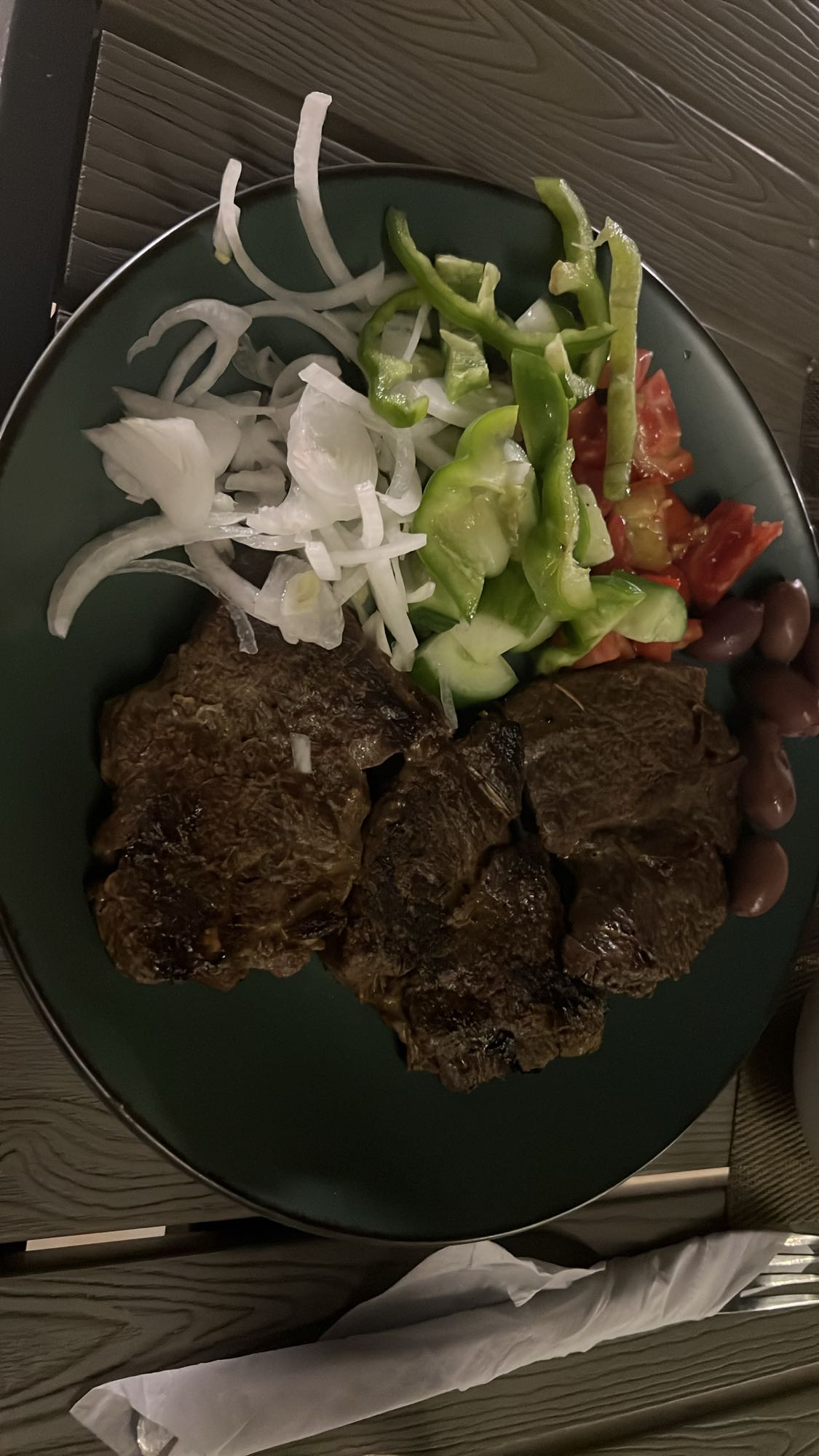 Steak with salad and olives