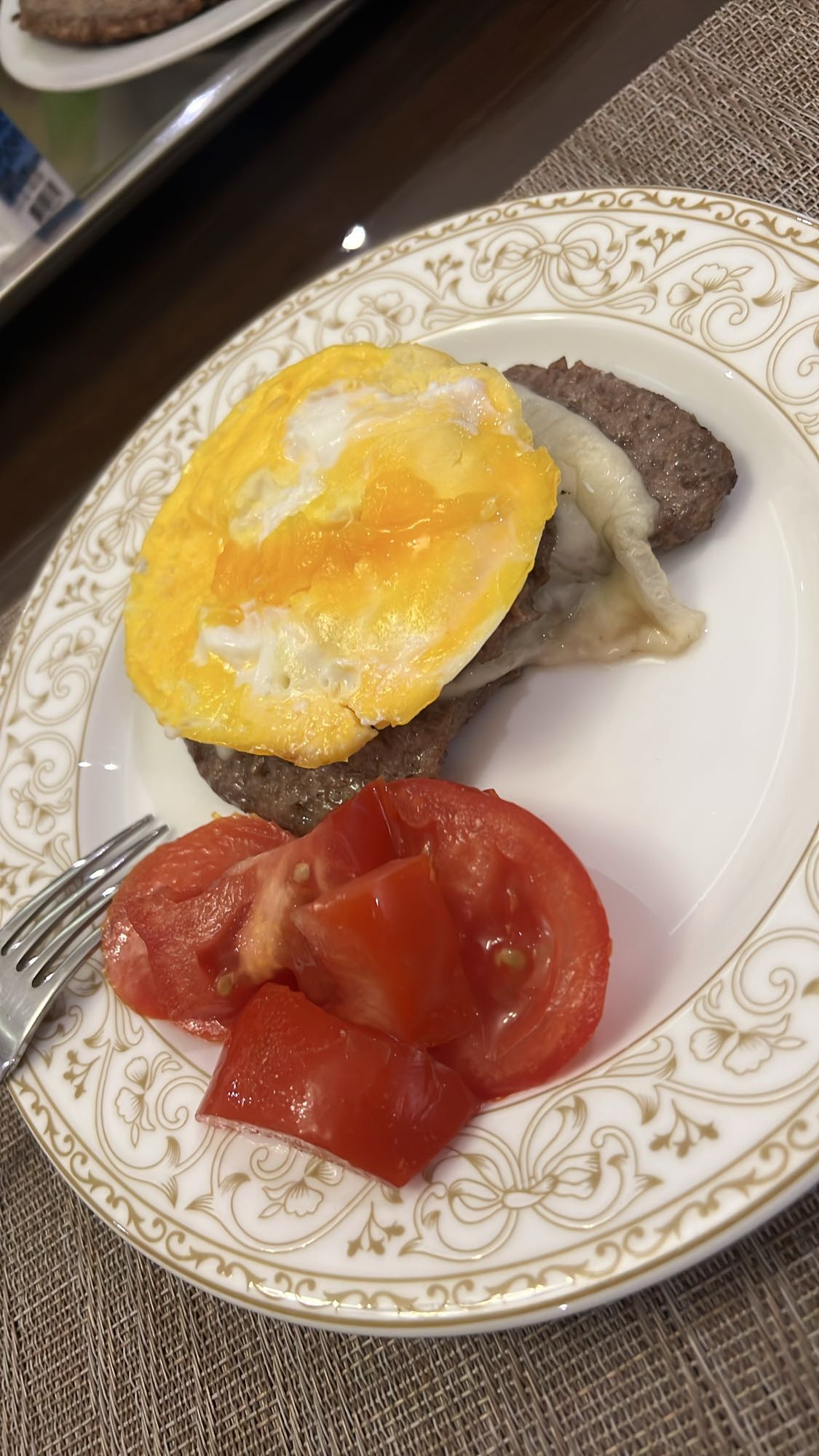 Egg, beef, cheese, tomato plate