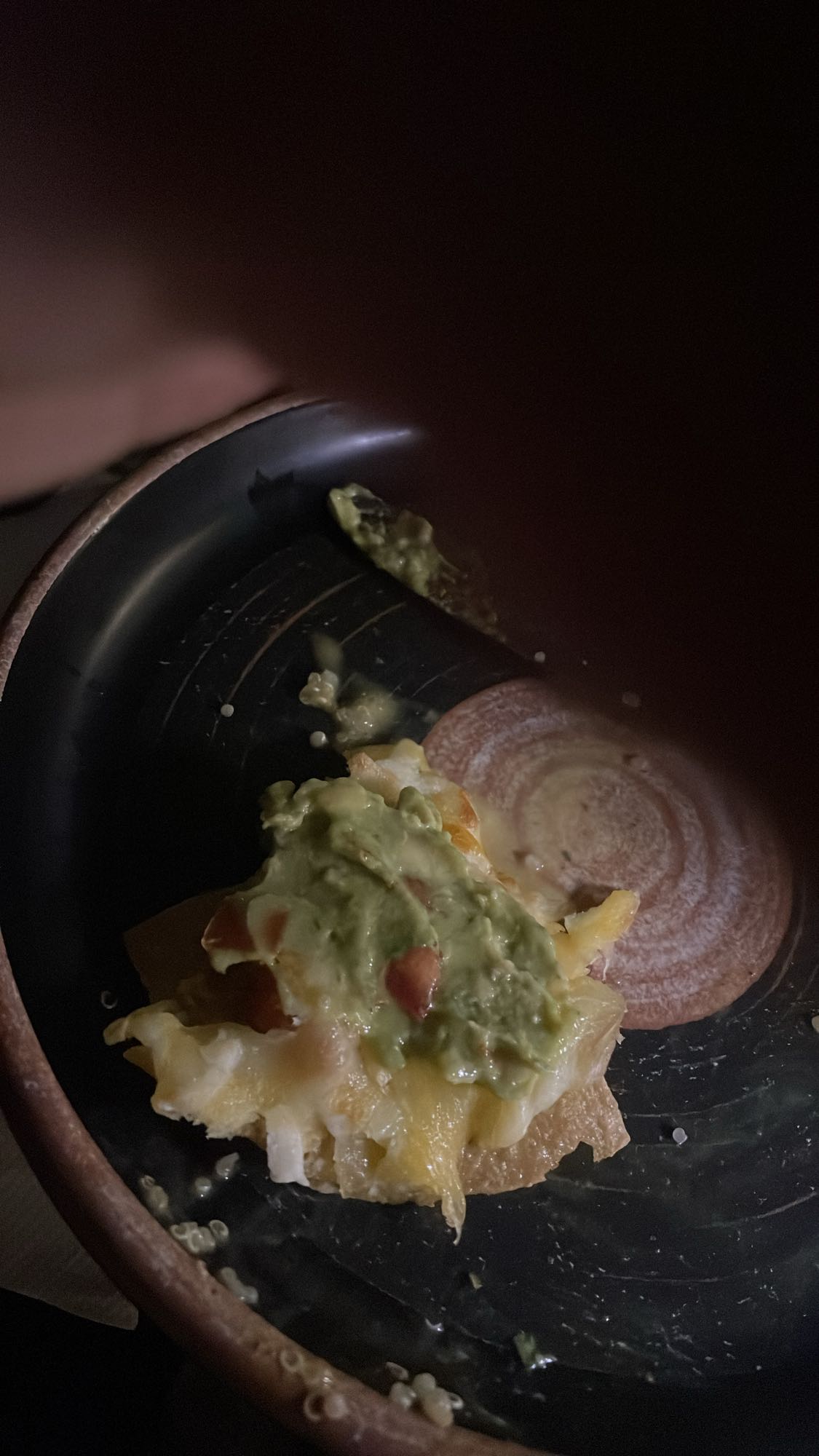 Cheesy nacho with guacamole