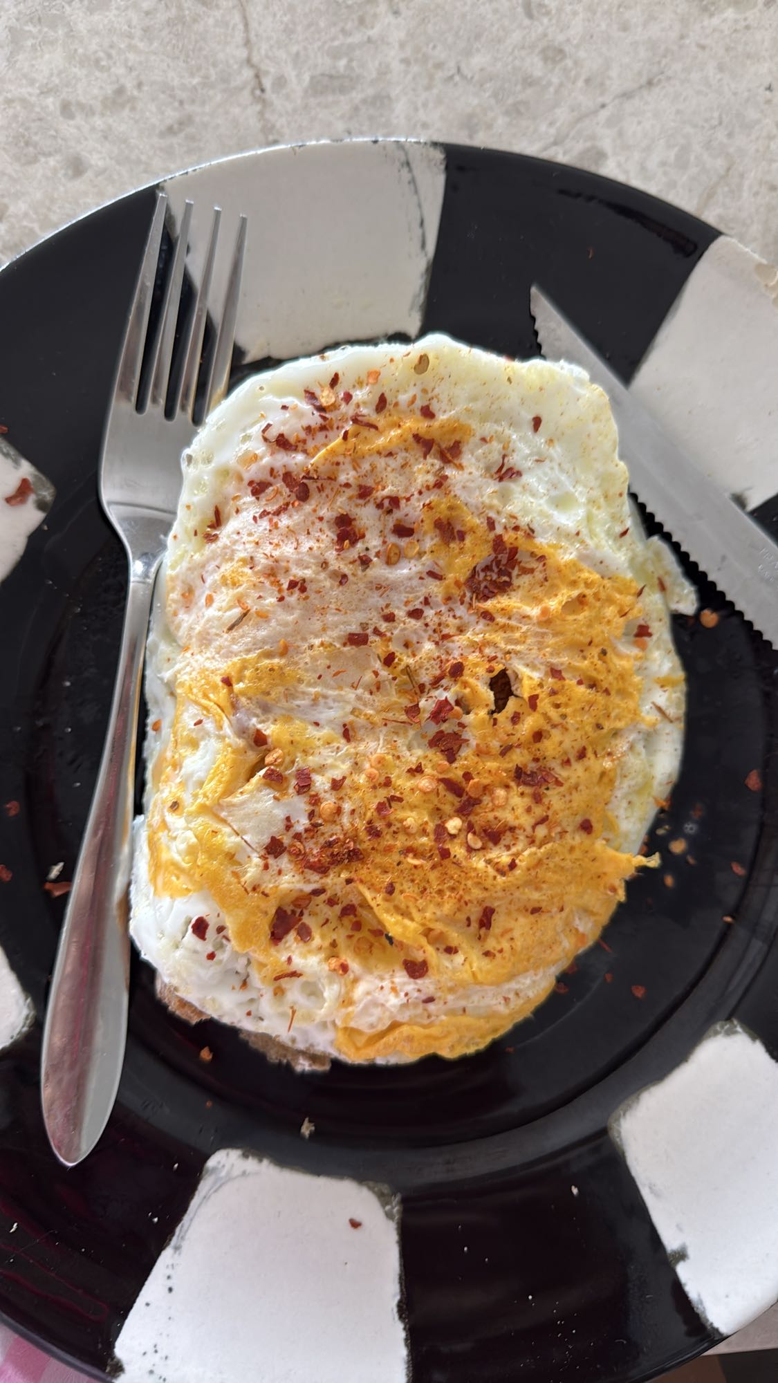Fried eggs with chili flakes