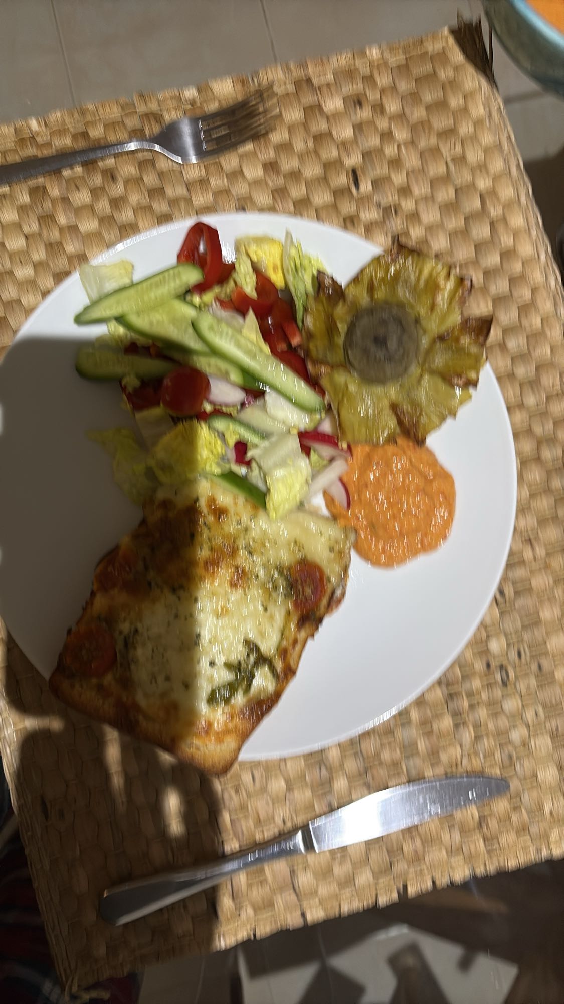 Pizza slice with salad
