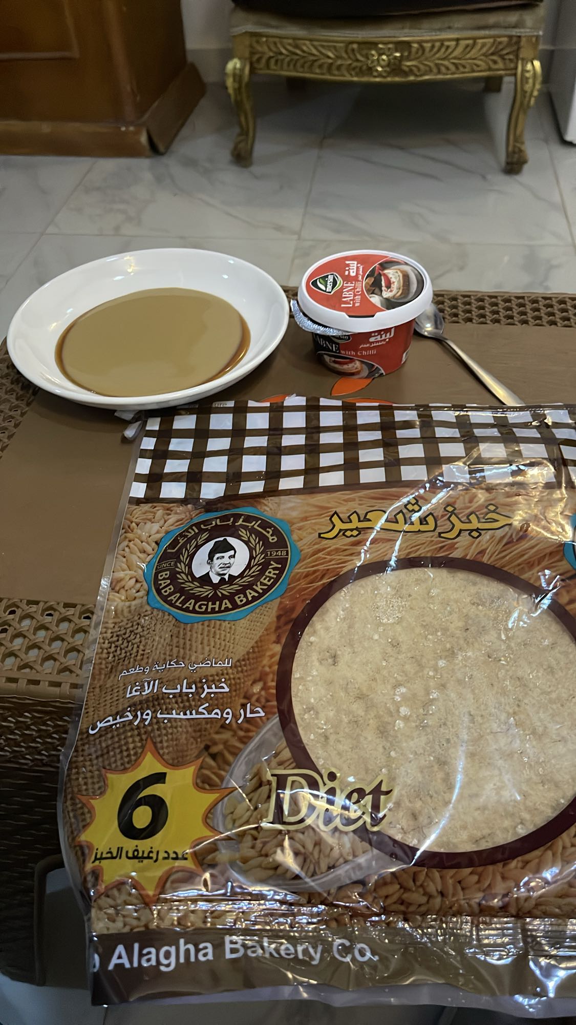 2 barley flatbread with date syrup and tahini with labneh and herbs