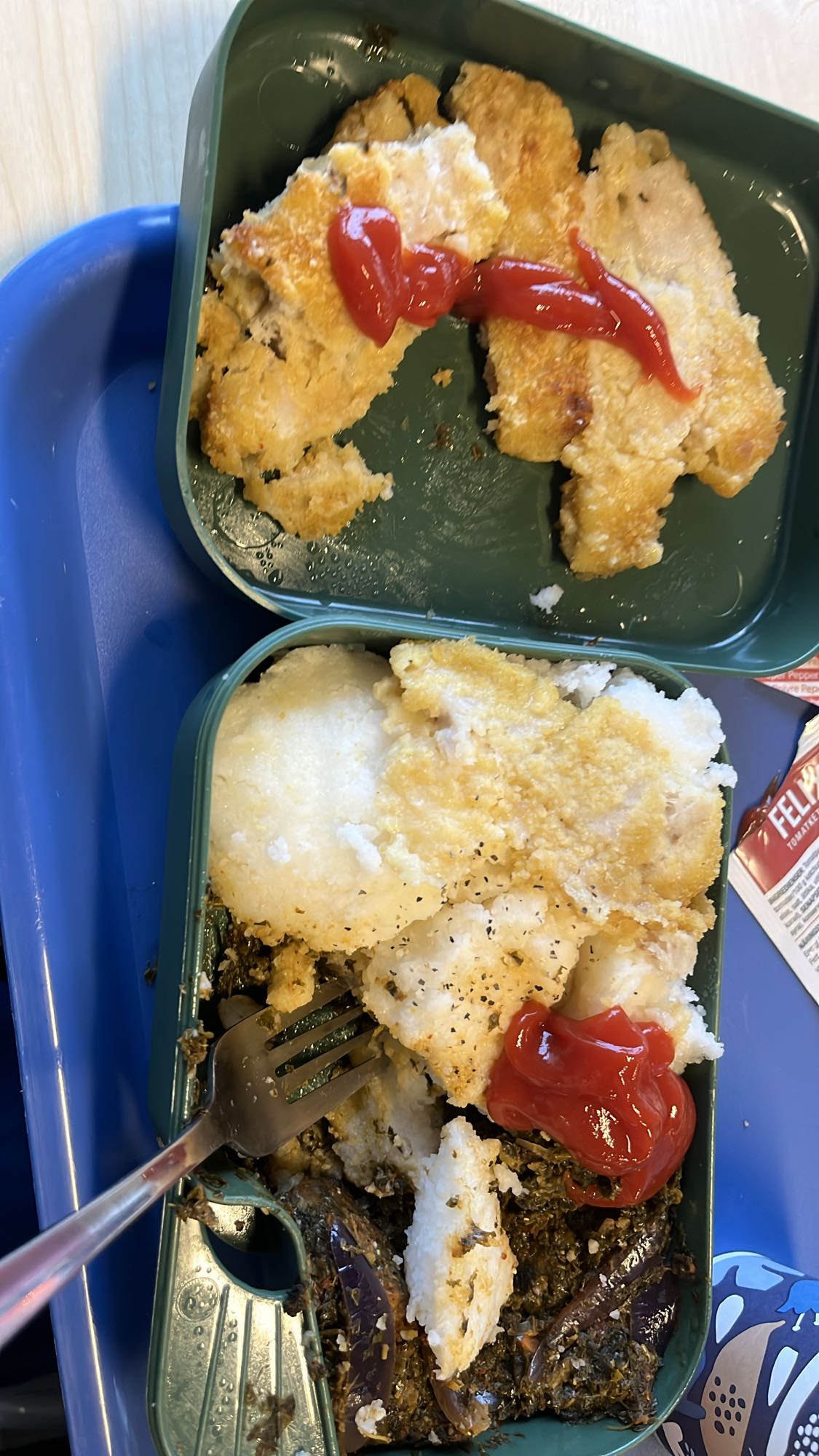 Fried fish with pap and greens