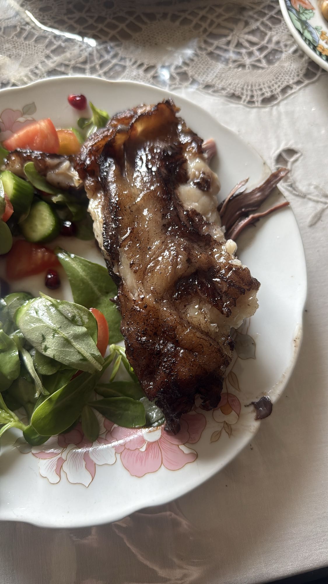 Grilled beef rib with salad