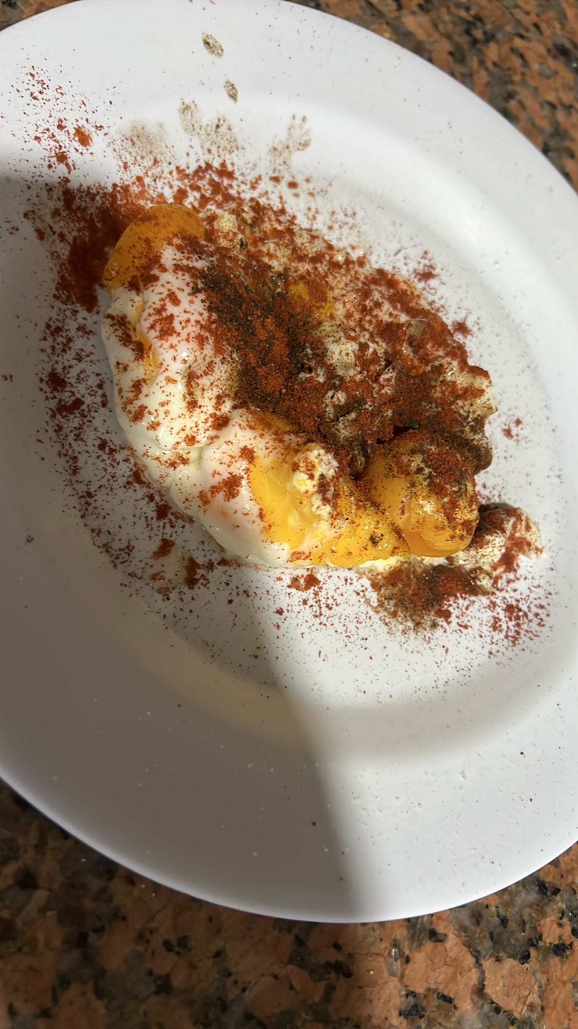 3 poached eggs with paprika and black pepper